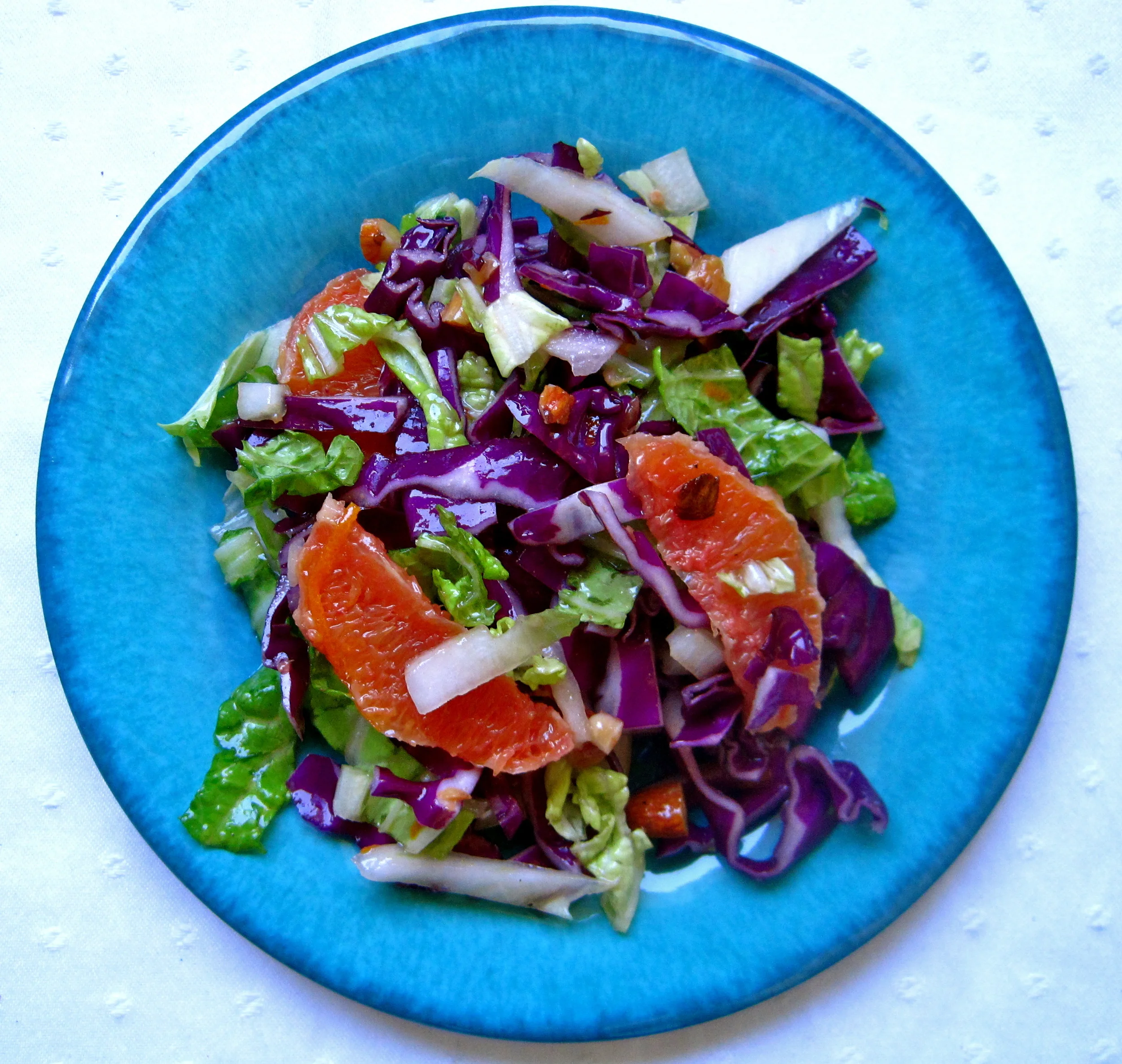 Cabbage Salad with Ginger-Sesame Vinaigrette, Roasted Almonds, and Cara Cara Oranges
