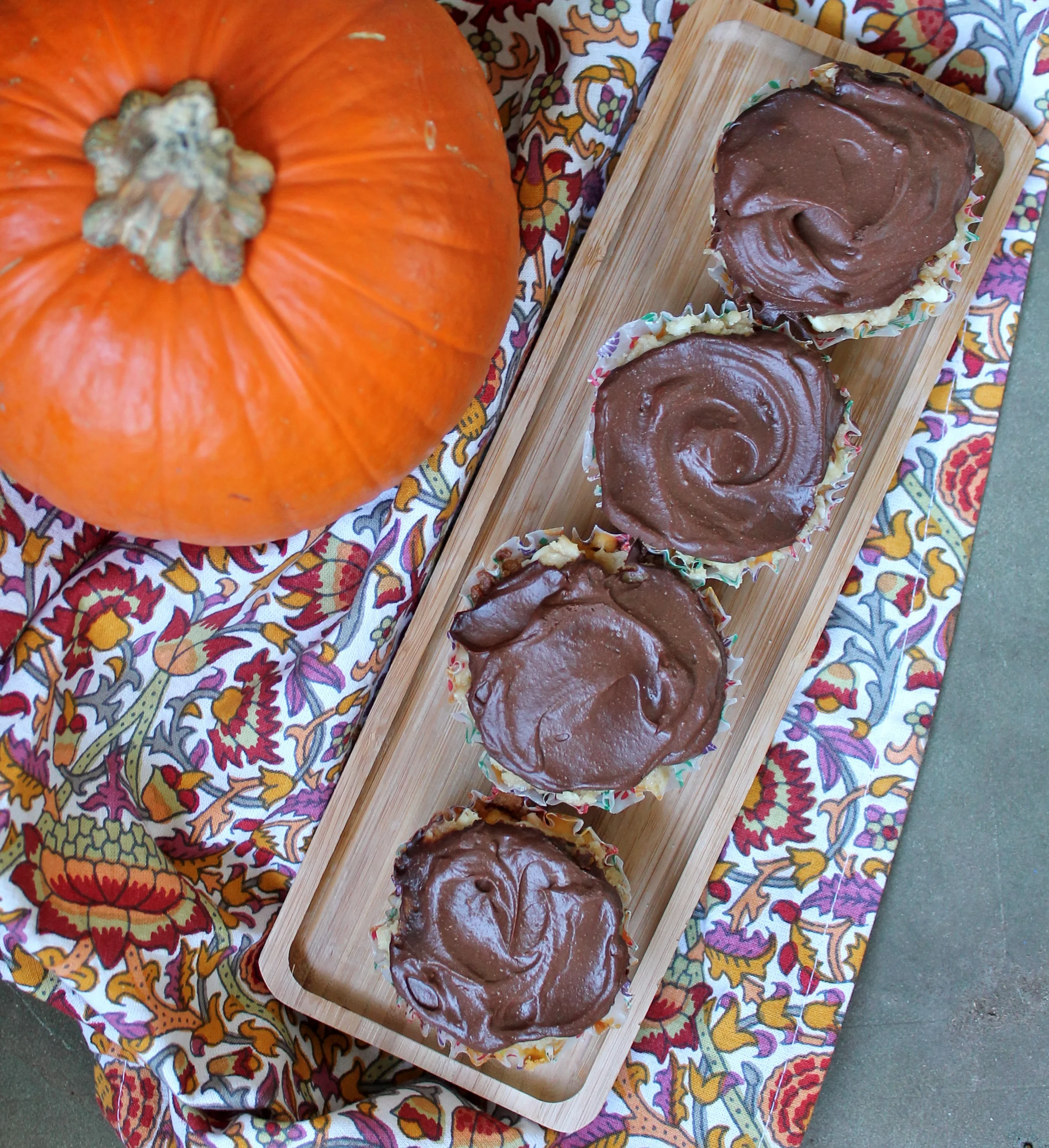 Mini Pumpkin Cheesecakes with Gingersnap Crust, White Chocolate Cookie Dough, and Chocolate Ganache