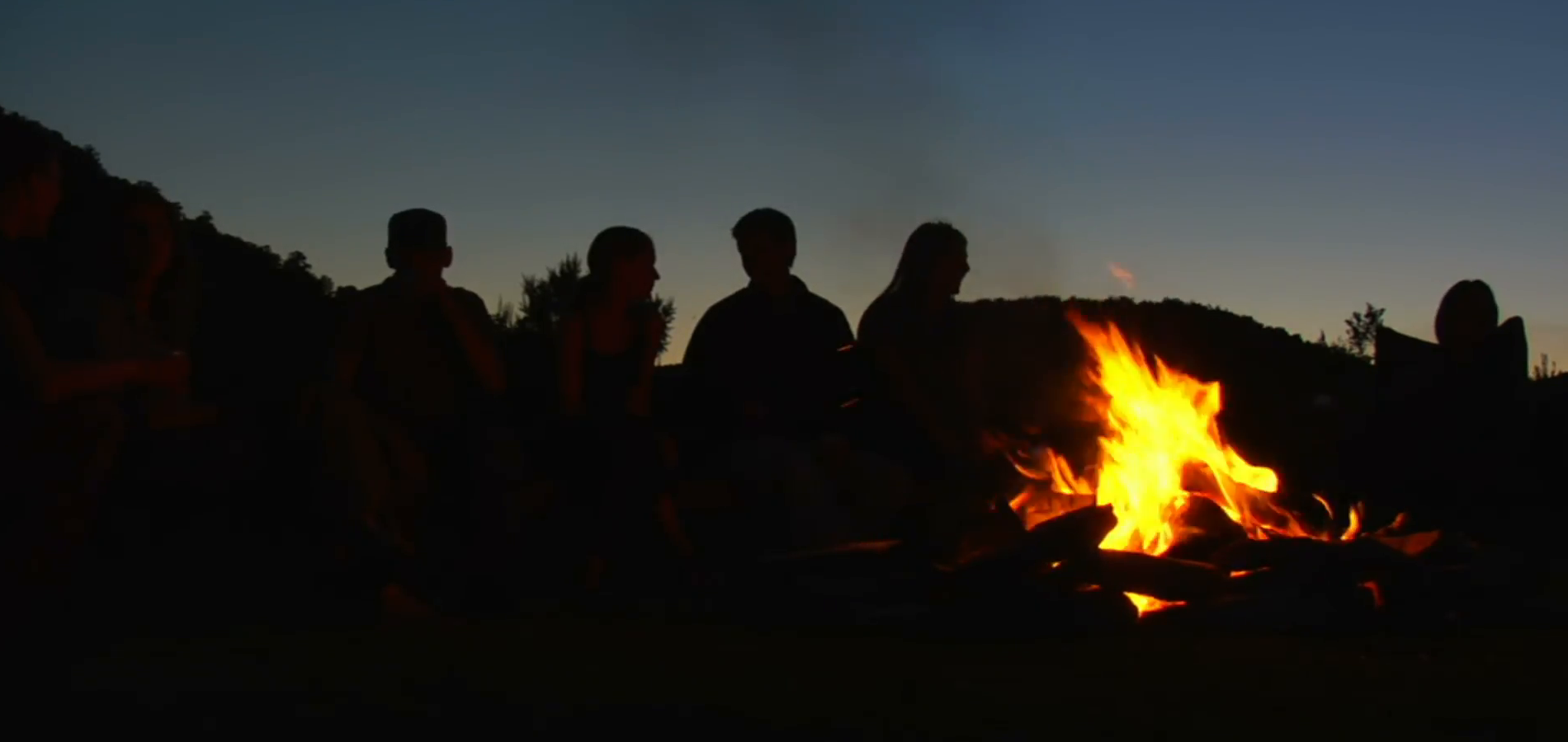 group-sits-around-campfire-at-dusk_z1s7lxgbb__F0000.png
