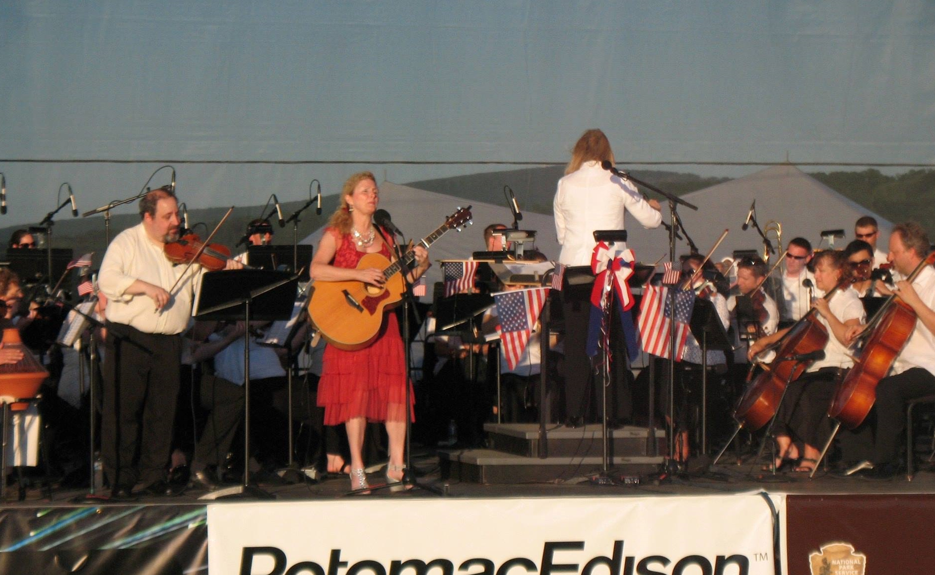  With Jennie Avila and the Maryland Symphony Orchestra under the direction of Elizabeth Schulze. This was for the orchestra's July 4th concert at the Antietam Battlefield. I got to play 2 of Jennie's songs with her and the orchestra and they played a