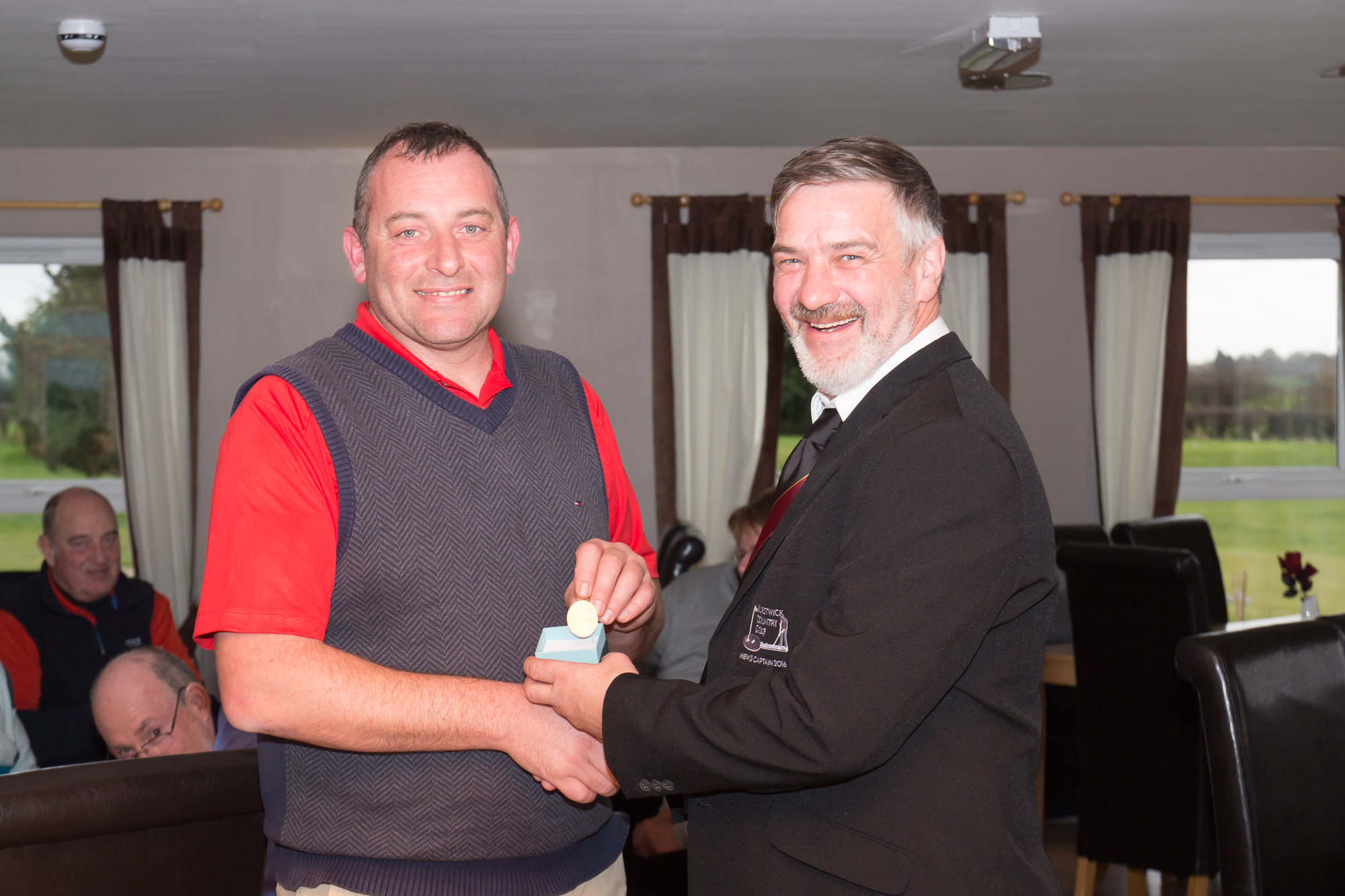 Alan Mackinnon (2016 Men's Captain) handing a Past Captain's badge to Andy Wilson