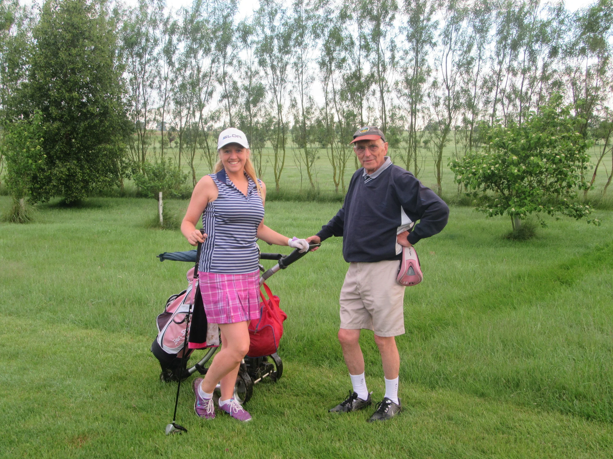 Laura with caddie John Dickins, after the first 18 holes.