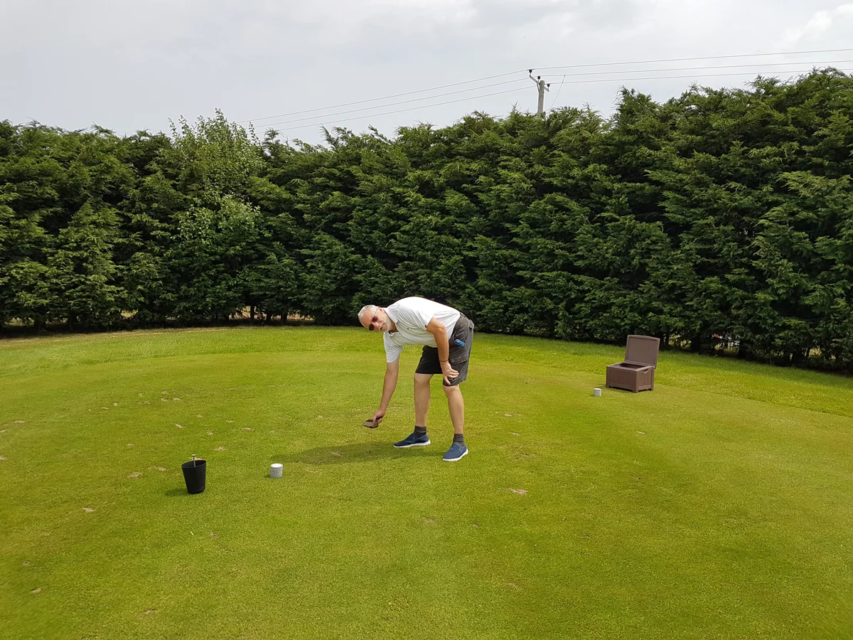 Bruce Carter divoting tees and cutting out sprinkler heads