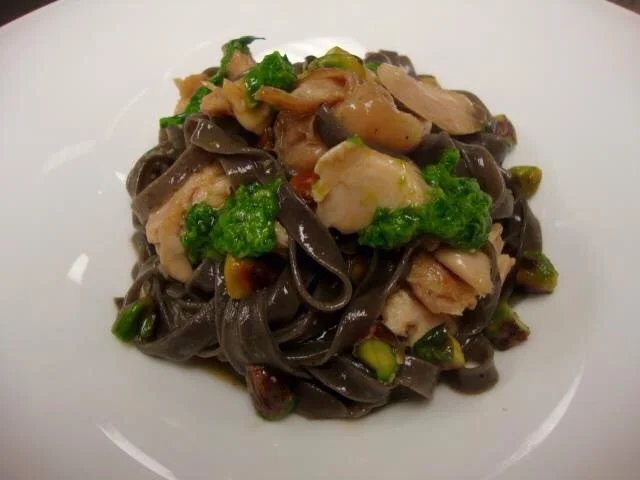 Black olive Tagliatelle, braised rabbit, ramp pesto, pistachio