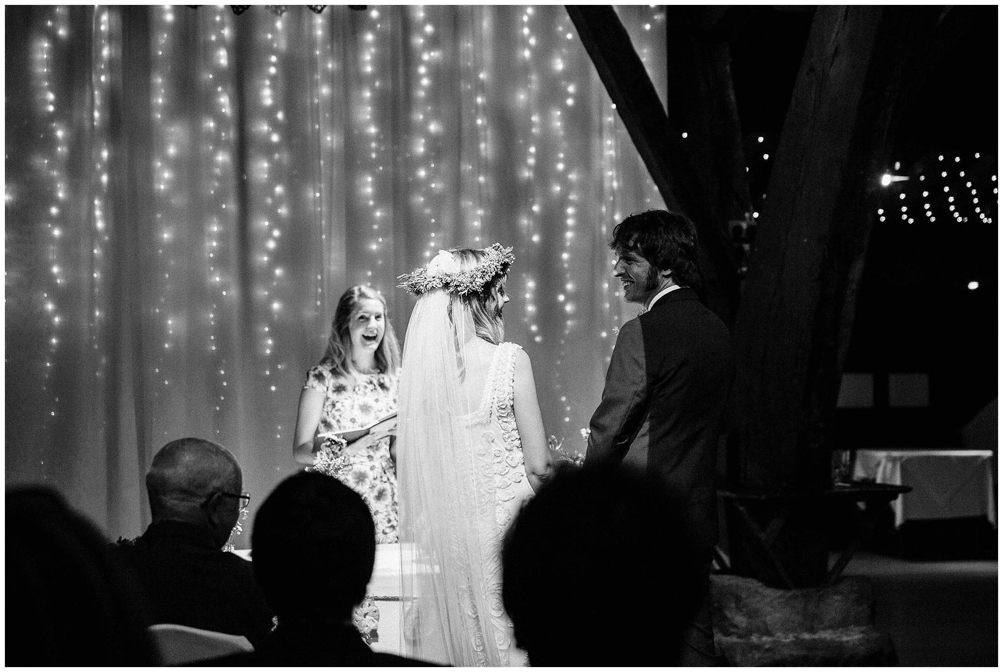bride and groom looking at each other lovingly during ceremony