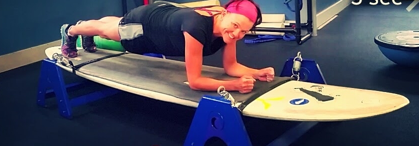 Plank on a wiggly, suspended surfboard. I couldn't do this five weeks ago.
