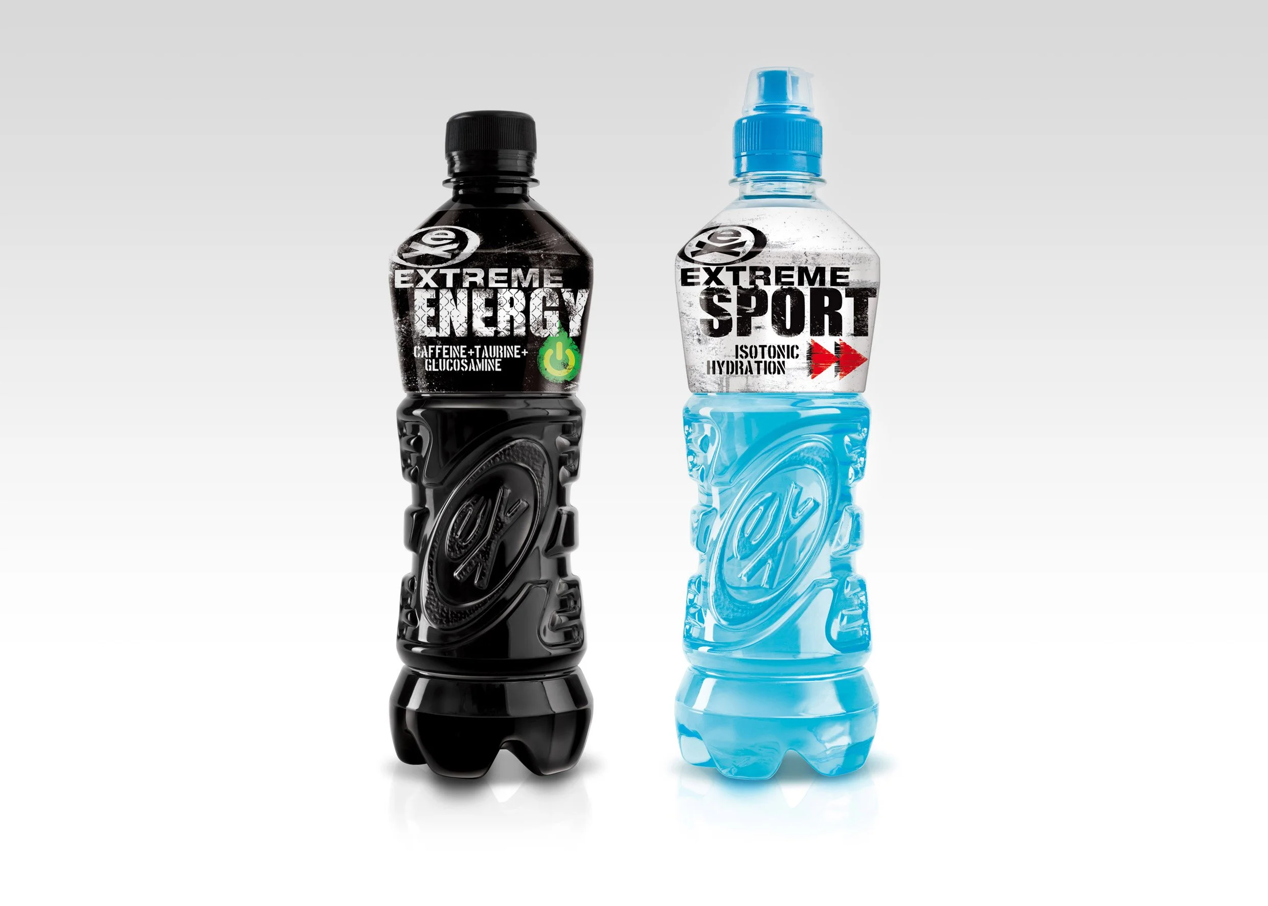 Two sports drinks bottles, one black and one blue, with labels reading 'Extreme Energy' and 'Extreme Sport', standing side by side on a white background.