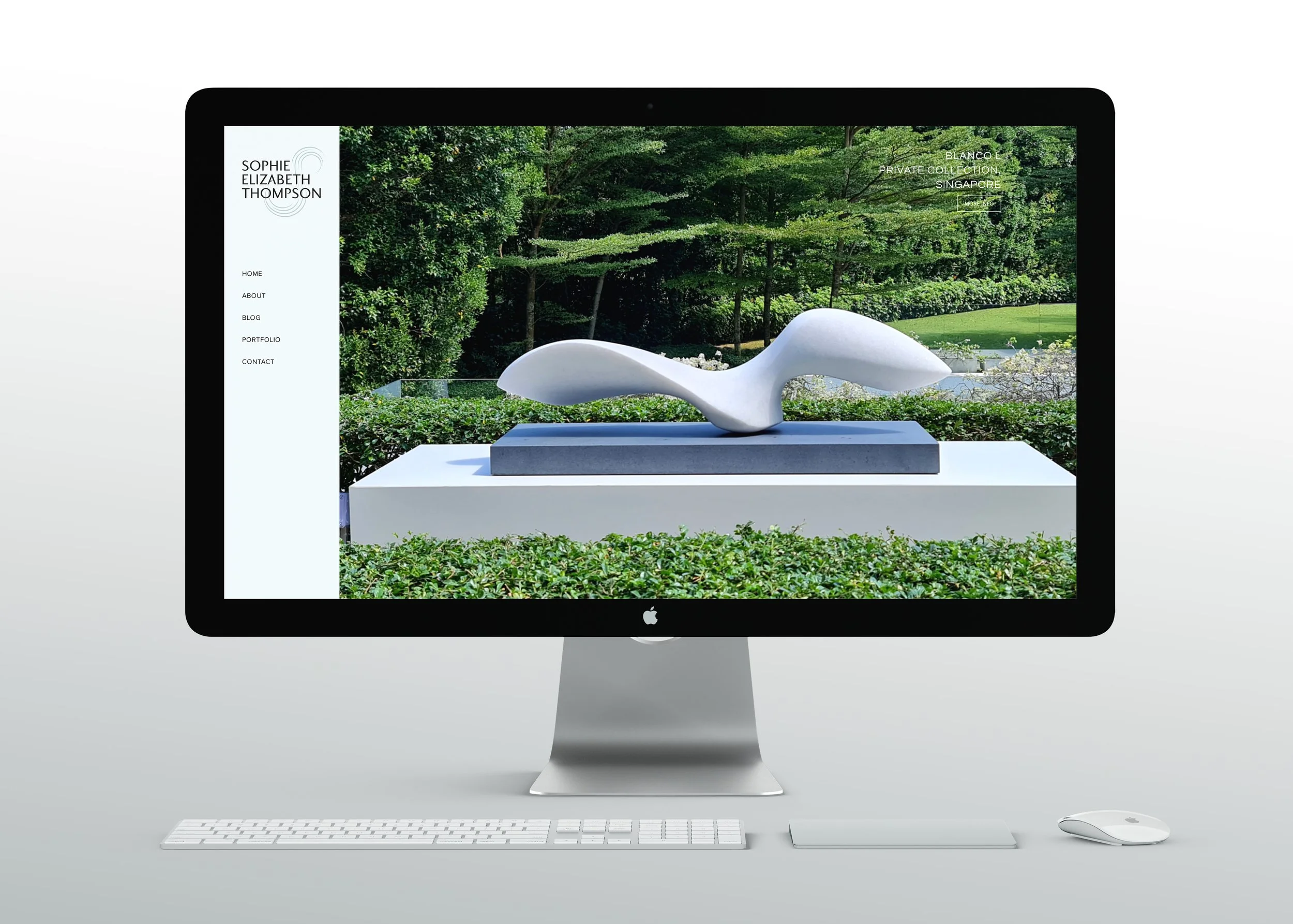 iMac computer displaying Sophie-Elizabeth Thompson website featuring a white abstract sculpture outdoors with green trees in the background.