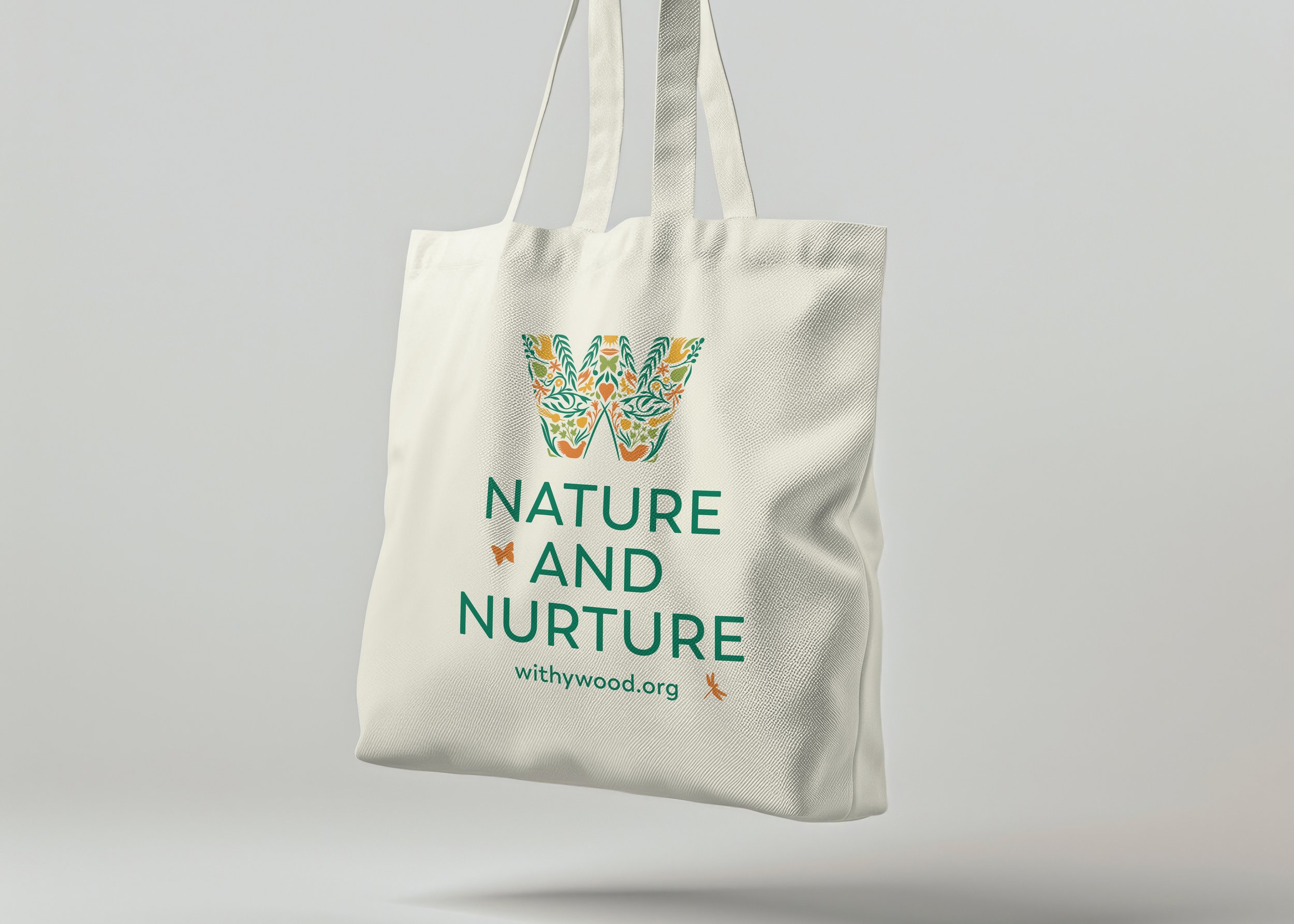 Withywood - White reusable tote bag with colourful brand design and the text 'NATURE AND NURTURE' along with a website URL.