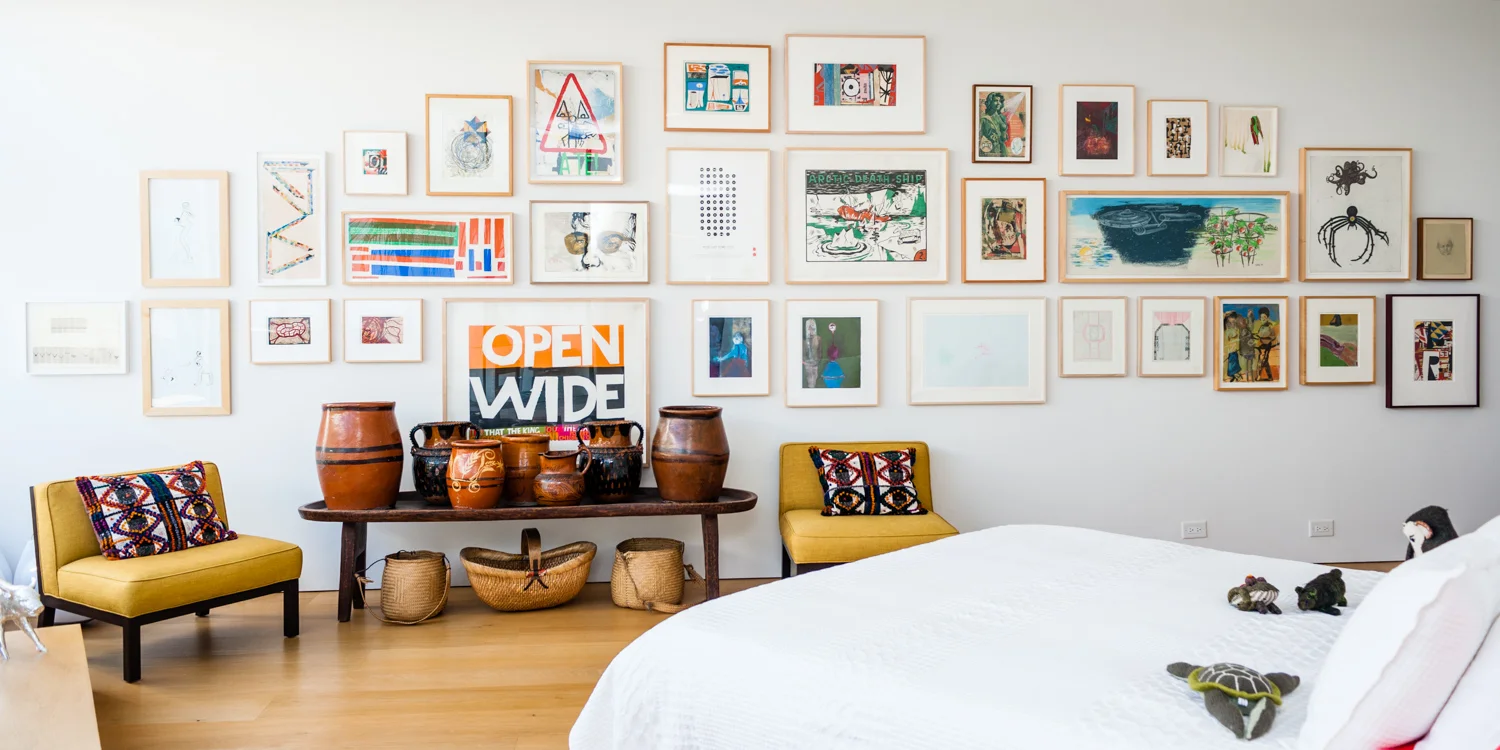 Bedroom with wide gallery wall.