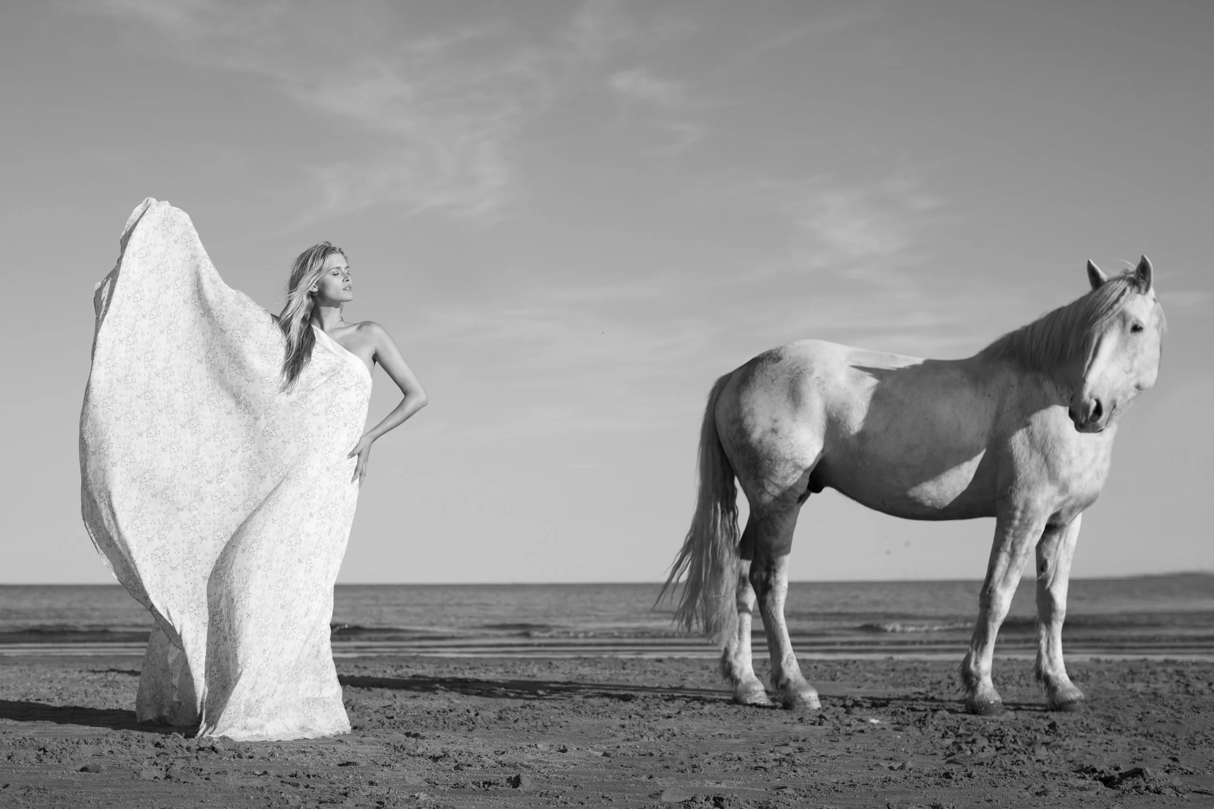 Why did you begin including yourself in photographs with horses? My relationship to horses is a complex one, but I’m not sure the focus should be on horses, rather on nature itself. Horses just became the personal choice through which nature seems most represented in the way I see it - strong and powerful and full of sensitivity and beauty. I think the subject of nature itself is a complex one not easily defined by man. Horses represent one of the most noble and strong creatures that have bonded with man throughout history. I actually started by shooting women with horses trying to capture something visceral that went beyond just capturing beauty or a pretty image with horses or in nature. I found myself never content and felt like I was projecting these emotions and sentiments on somebody else, and, then I began shooting myself with the horses. How does your connection to horses and nature conceptualize the synthesis of human intellect with animal instincts and how do these principles guide your own life? I believe man is an animal in his own right, not a blended species. I think we carry with us instincts that are animal in nature because our roots and our bodies and emotions are all based on human/animal nature. I don't think we humans are separate from animals or nature; we don't live in nature - we are nature. We are all part of the same ecosystem. Since I was a child I think I have been very in tune with nature and animals. There is something calming about it. Which philosophers do you study to support your own ethics concerning human nature? Nature, by design, is in constant conflict. From the very beginnings of evolution and growth, things are pushed to grow or evolve. I most align with Thomas Hobbes who very much believed that man was an animal in the sense we have to live under some form of rules or regulations, or else we will be in complete conflict with each other. What do you appreciate most about Hobbes’ philosophy? Hobbes seemed to realize that humans, when left to their own devices, will almost always end up on a path to turmoil and self or social destruction, which is how the idea of social contract theory and an elected government or authority was conceived. I find it fascinating that amid all the current social and political problems and opinions, when we strip away the extraneous layers, we see exactly that the real root of the problem is our own animal instincts. Whether it’s from people fighting for more power, for more money, or more control, it all boils down to some pretty basic emotions that are unharnessed and let roam free. The word philosophy is taken from the Greek word, (phileo) meaning "to love" or "to befriend" and (sophia) meaning "wisdom." Thus, "philosophy" means "the love of wisdom". Does your art embody a certain philosophy? Through art, I am striving to have a conversation about man’s instincts and relationship with the natural world. Horses for me have become the link to the natural world. I am not sure if there are rules of civilization, but I want to explore the ideas of how closely linked we are to nature and explore my own animality and how it relates to the culture of today. Nature is my philosophy – that’s probably the easy answer to the question.