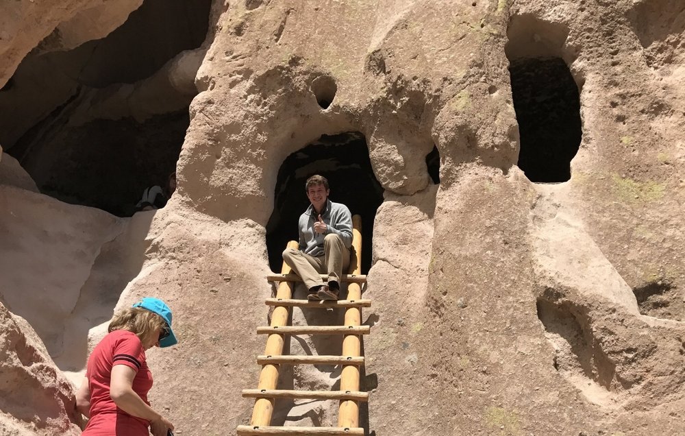 JD Sitting Outside a Cliff-Dwelling at Bandelier National Monument