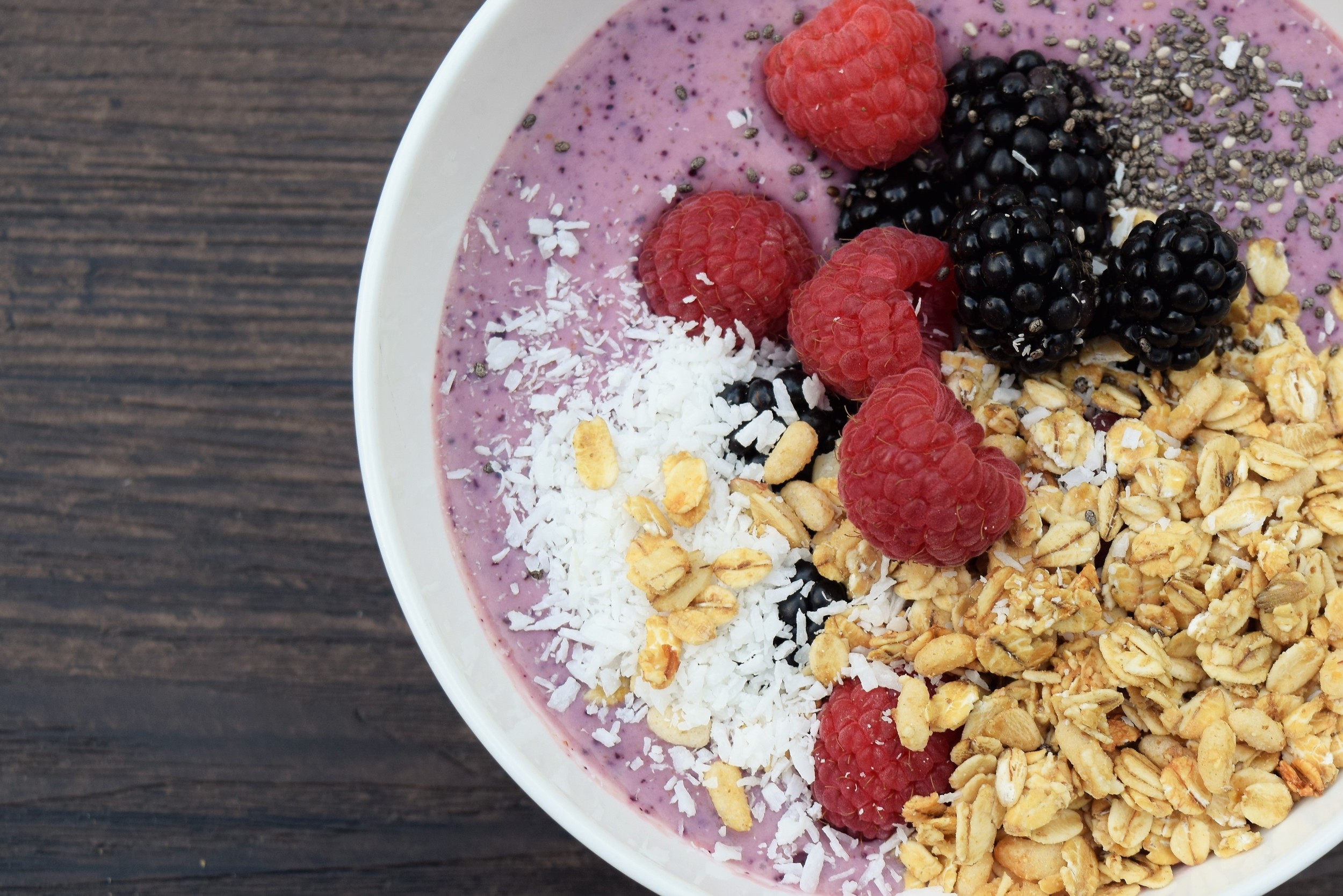 Fruit smoothie bowl with Greek yogurt, granola and nuts