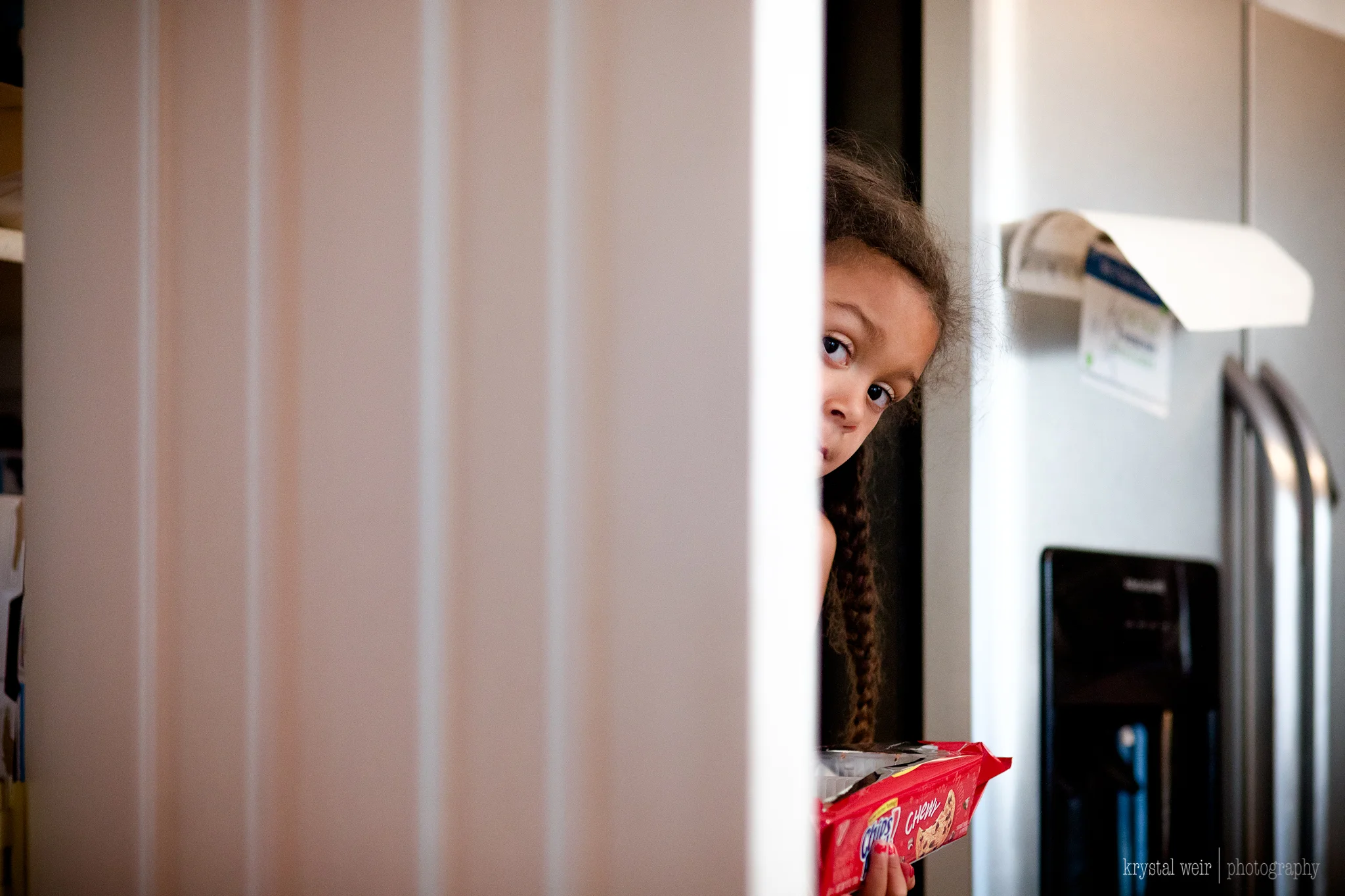 Day 8/365 Hide your snacks because this kid will eat them up real quick! 😂😂 Here she is asking for one more cookie! How many of you struggle with your kids wanting to snack all day, I'm sure most of you. I am dealing with this now. We try to have healthier options, but sometimes I give in to that sweet face maybe more often than I should. Luckily she does like her apples, grapes, carrots, strawberries almost as much as she likes cookies. When I saw her peeping from behind the pantry door I knew this was going to be m shot of the day. This photograph just makes me chuckle and the way she asked for that extra cookie was so funny too. I love when they make it easy to choose my photo of the day. 
