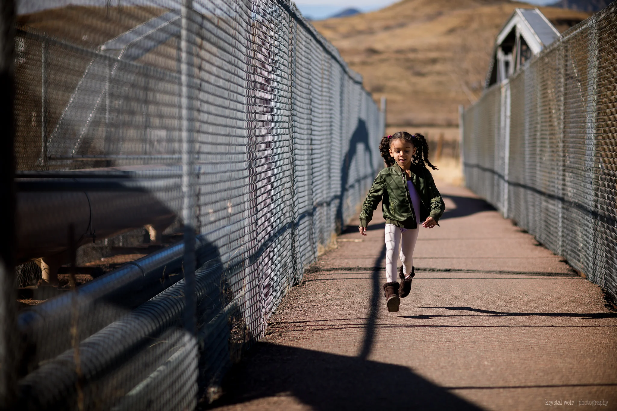 Day 30/365 She got an extra pep in her step after Ballet class today! Bridges can be fun to photograph. She had fun running up and down and I made sure to get ahead of her to capture her in motion. My shutter speed was fast because it was a sunny day, but also because I wanted to capture and freeze her movement without motion blur. 
