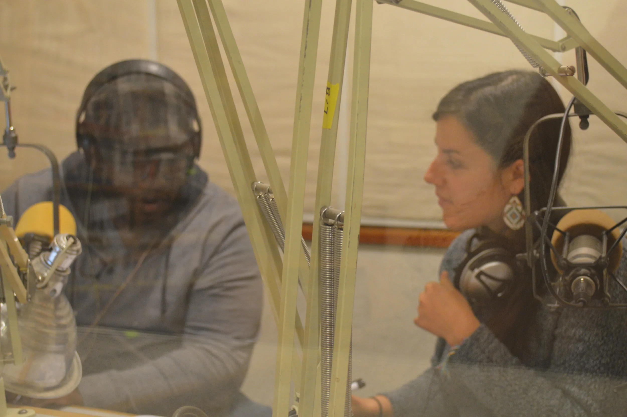 Discussing the next segment with co-host Vika Aronson