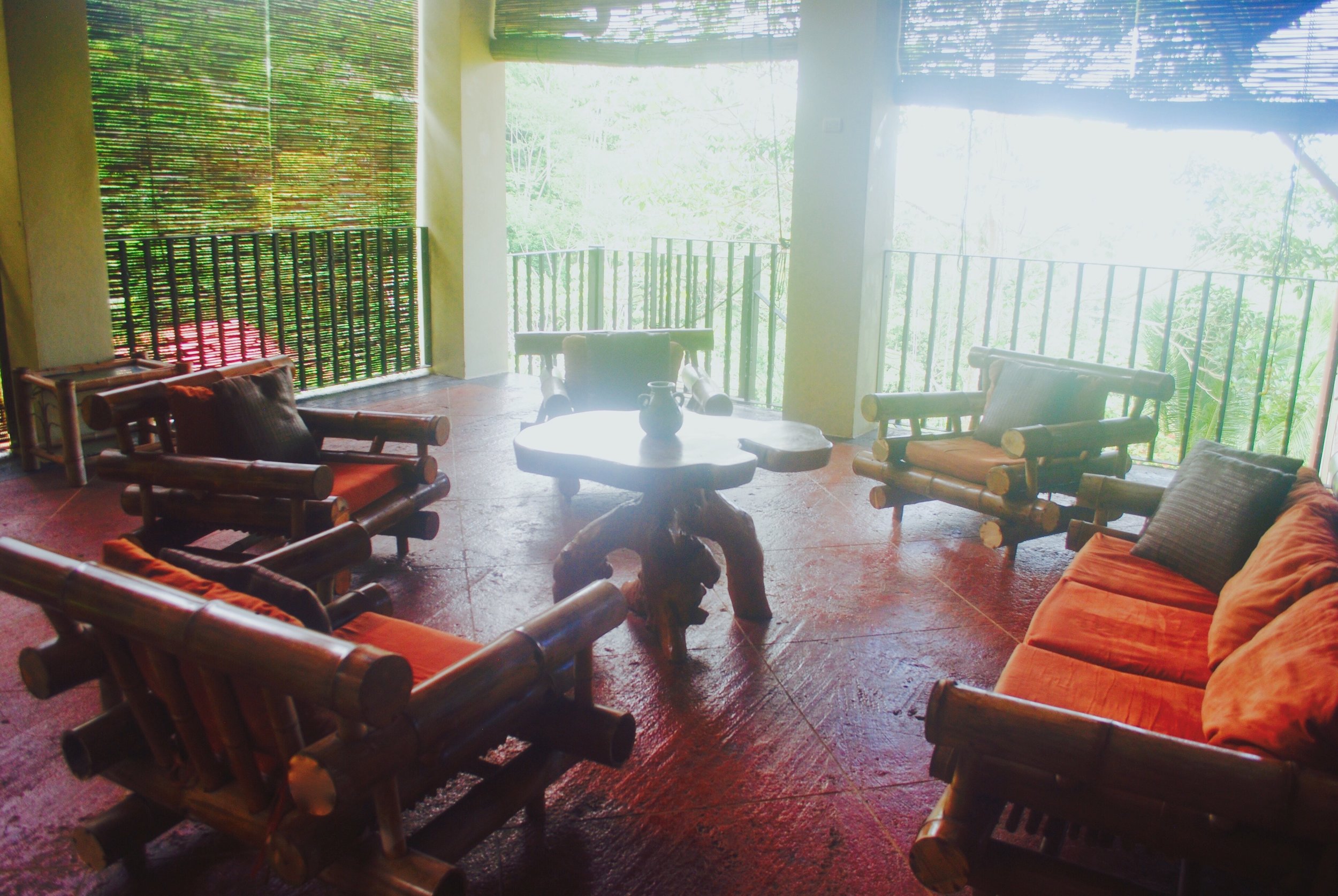 This is just one section of the open-air veranda. For our yoga sessions, we'll clear the furniture out of the way.