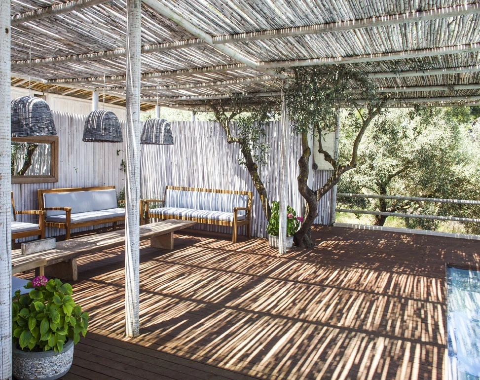 This is just one section of the open-air veranda. For our yoga sessions, we'll clear the furniture out of the way.