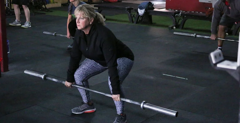 All barbell movements in a workout begin with an unloaded barbell to ensure proper mobility and movement patterns. 