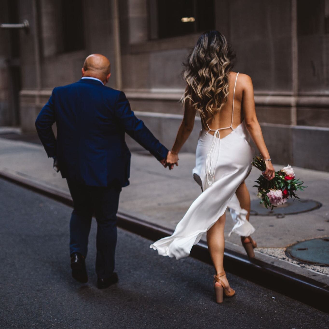 Hand in hand, and ready to take over the world together. #nycbride 🔥