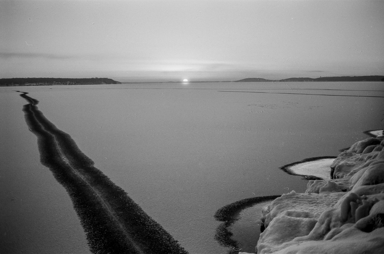 Sunset Over Snow-Dusted Black Ice, Green Lake, Wisconsin