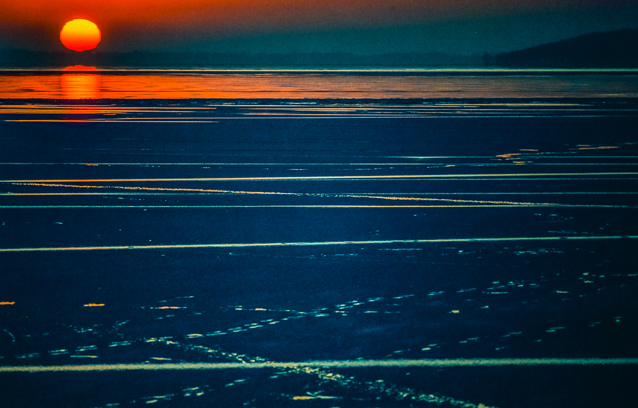 Green Lake Sunset Reflection With Blue Thawing Ice 