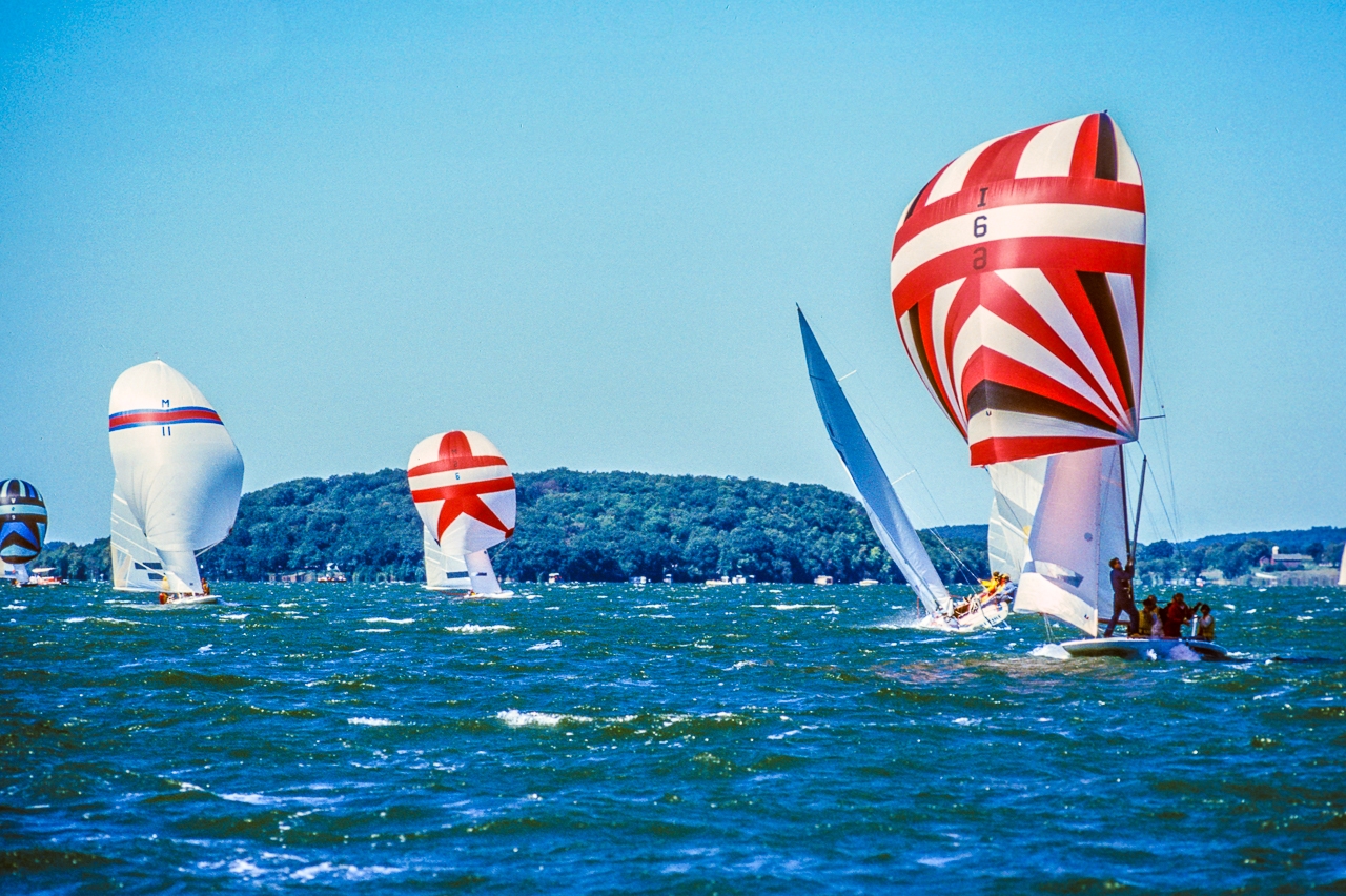 Racing Sailboats Fly Spinnakers on White-capped Green Lake