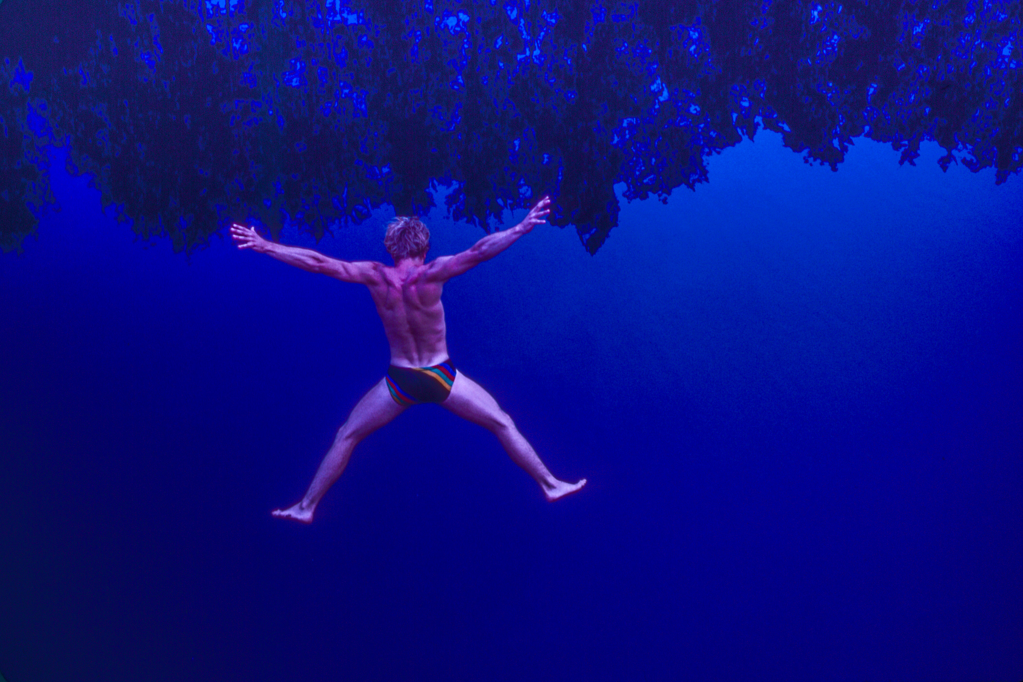Daring Cliff Diver Seems To Hang In Midair