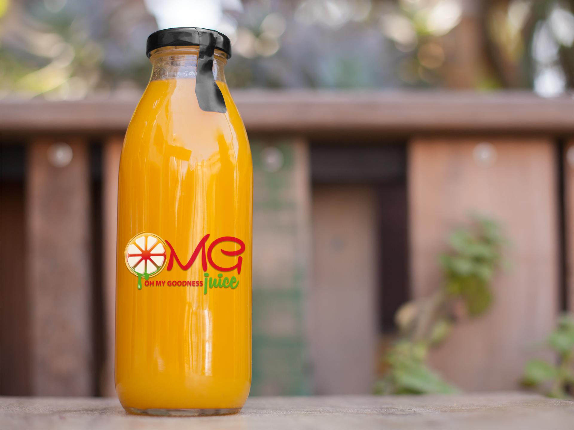 label-mockup-of-a-juice-bottle-sitting-on-top-of-a-table-at-a-patio-a7023.png
