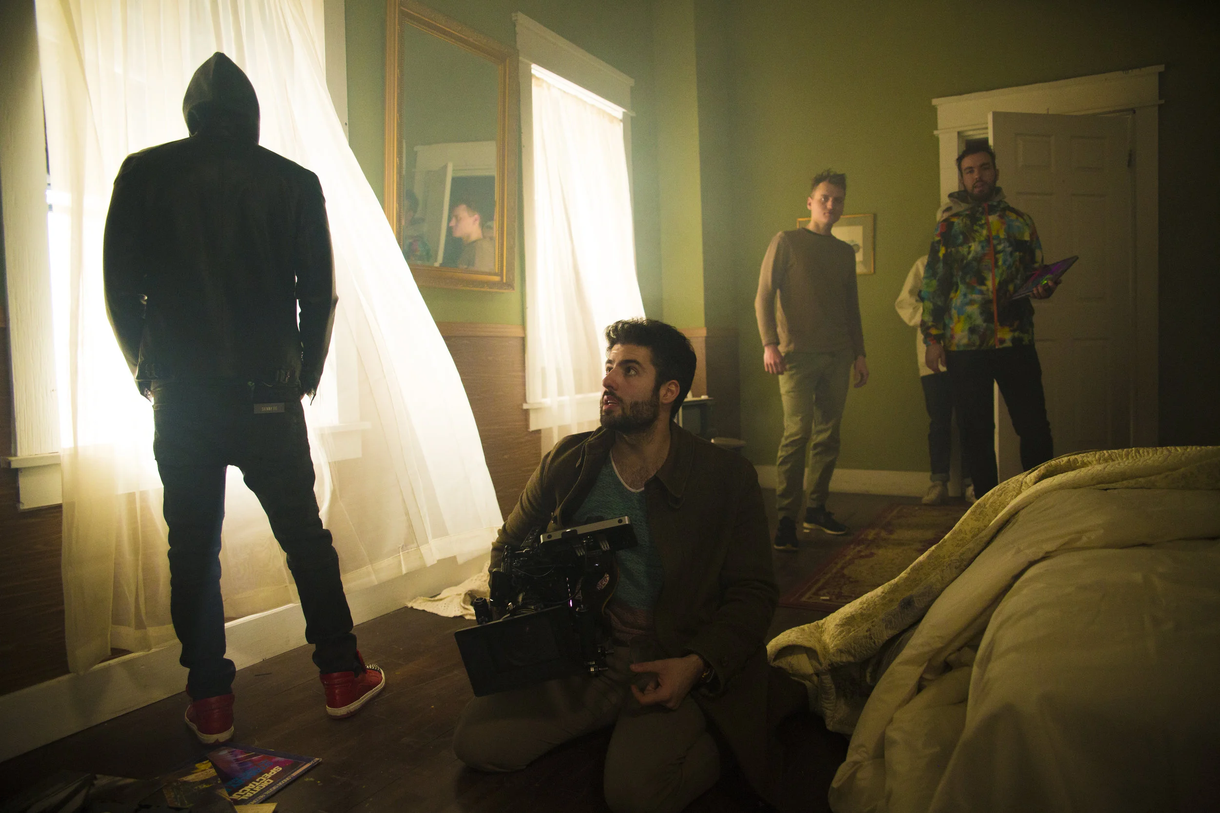Matt Bendo composing a shot on the set of Mind Games In Photo from Left to Right. Sickick, Matt Bendo, Julian Lomaga, Mark Klassen Photo Credit - Samuel Pollock
