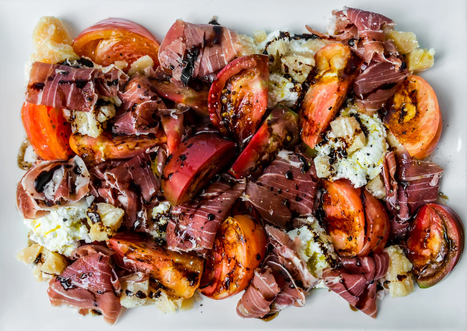 In the spirit of Emilia-Romagna, Italy : Heirloom tomatoes, Prosciutto di Parma, Parmigiano-Reggiano, ricotta, Aceto Balsamico di Modena, black pepper, flake sea salt : Pair with dry Lambrusco
