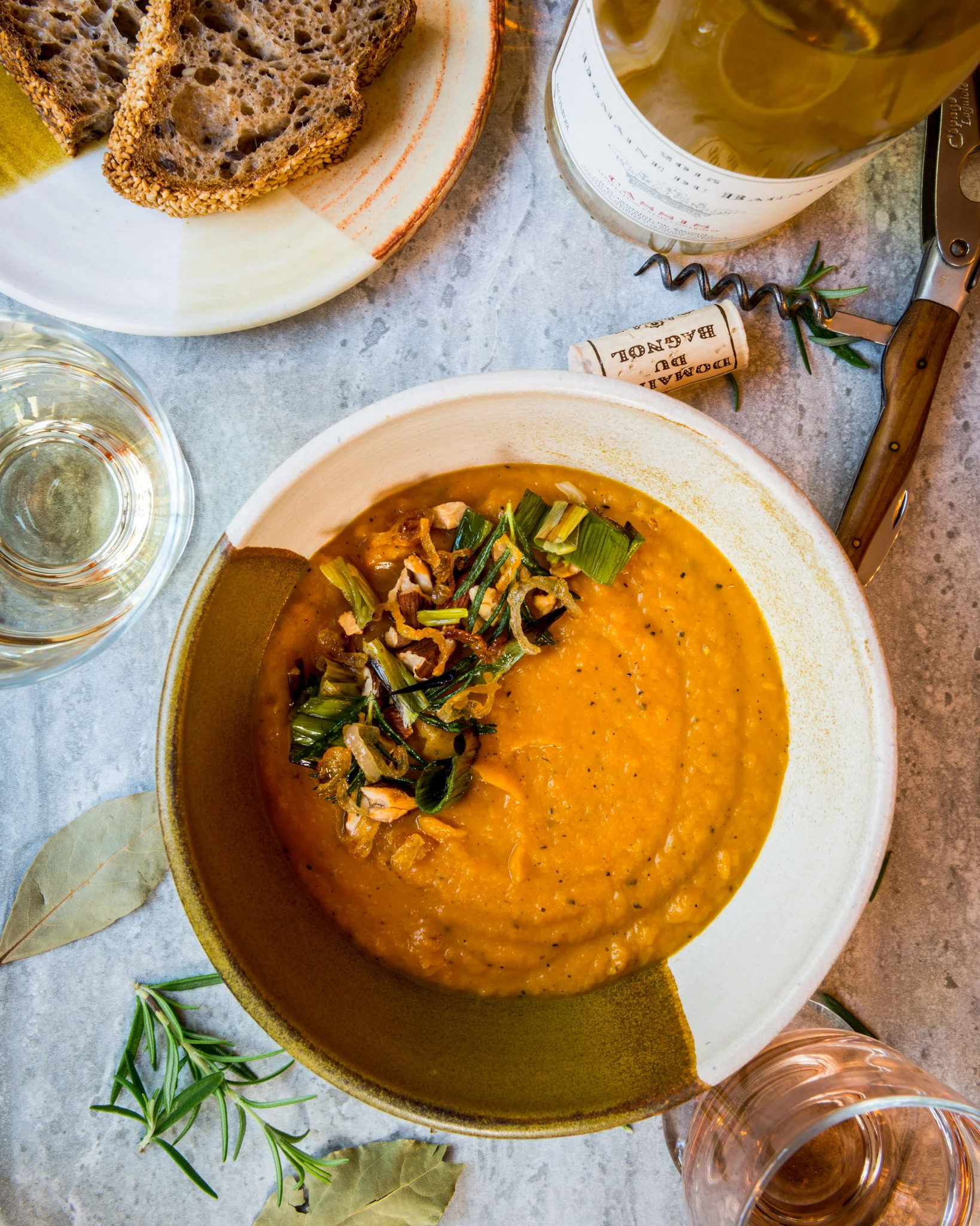 In the spirit of Provence, France : Roasted butternut squash soup, garnished with toasted almonds, charred leek, fried rosemary and sautéed shallot, bread : Pair with Provençal whites and rosés