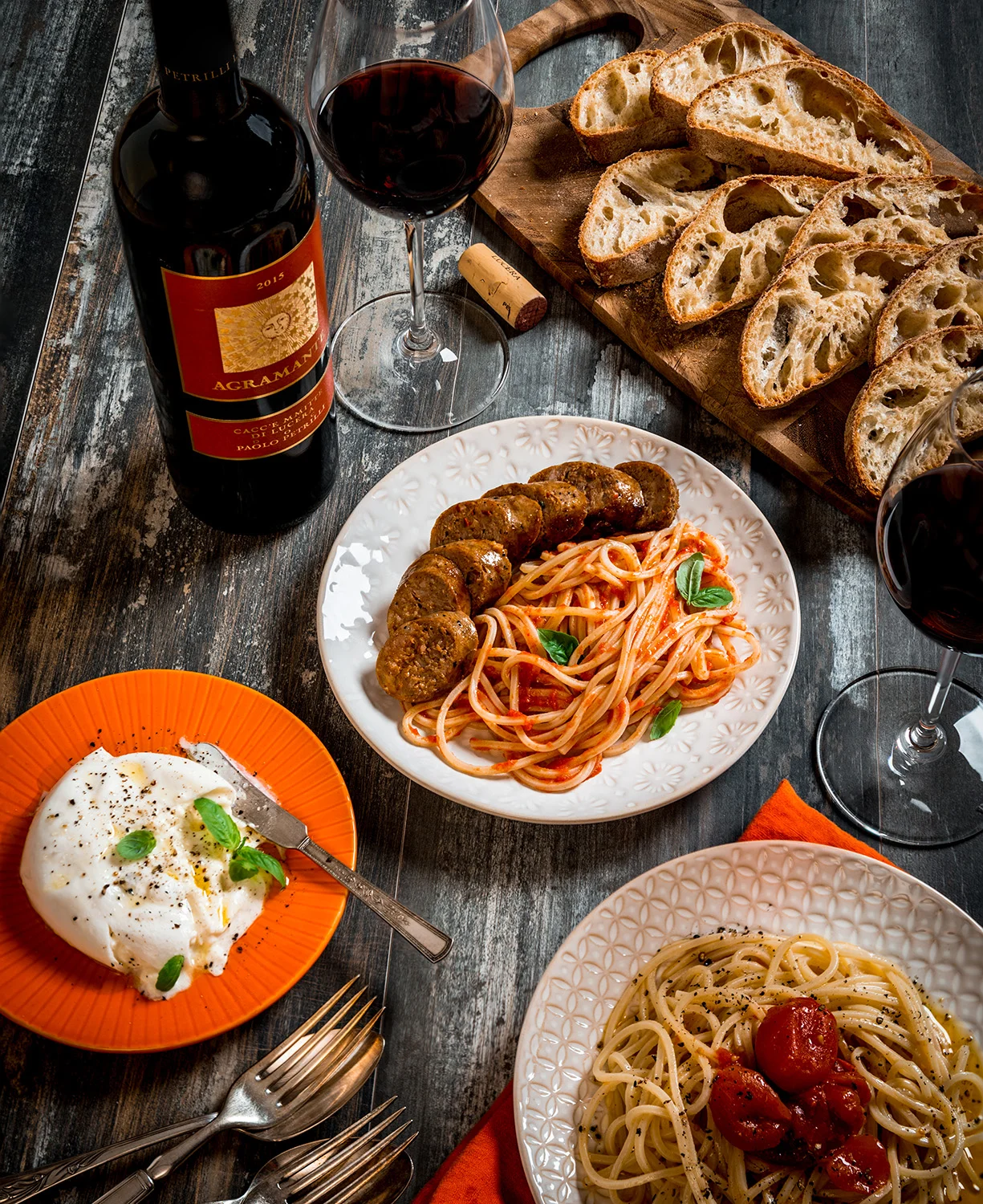 In the spirit of the Puglia, Italy : Pasta two ways; (1) with spicy tomato sauce, served with Italian sausage and garnished with basil, and (2) with gently stewed tomatoes in olive oil and cracked black pepper : burrata with olive oil, basil, salt and pepper : ciabatta : Paired with Paolo Patrilli's Nero di Troia-based blend : Pasta, tomatoes and sauce also come from the Petrilli estate