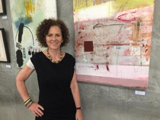 Lisa Lightman in front of her paintings at The Laundry gallery with me though Nov. 27. 