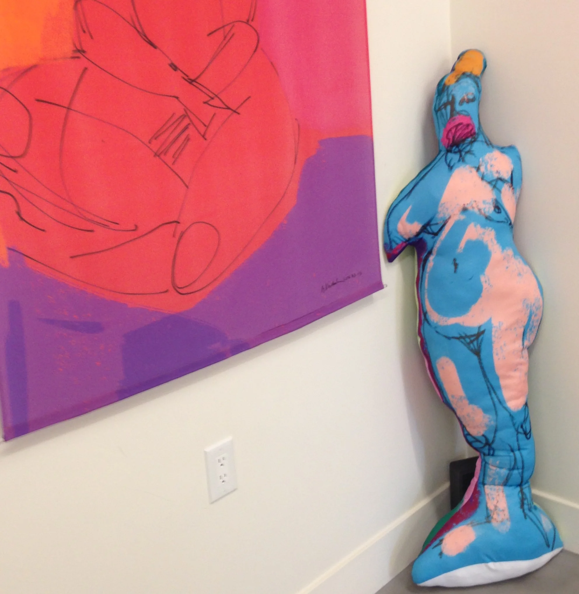 Leaning against the gallery wall next to one of my silk scroll paintings, here's my first life-size soft sculpture.