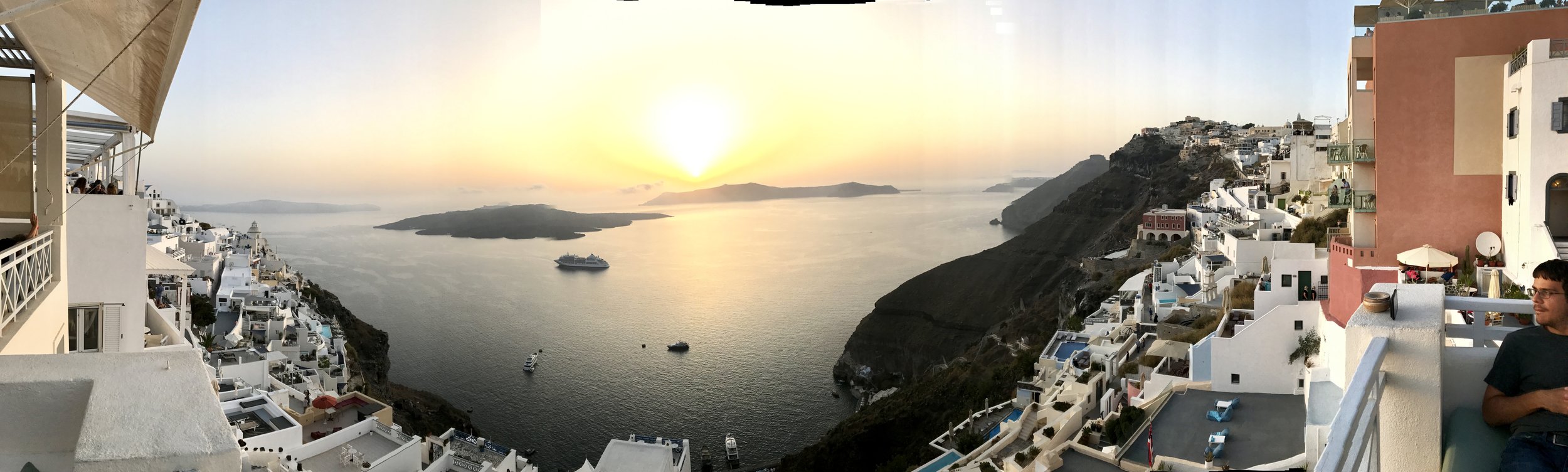 Striking sunset views atop Santorini after riding the cable car/incline to get there. Others took a mule ride.