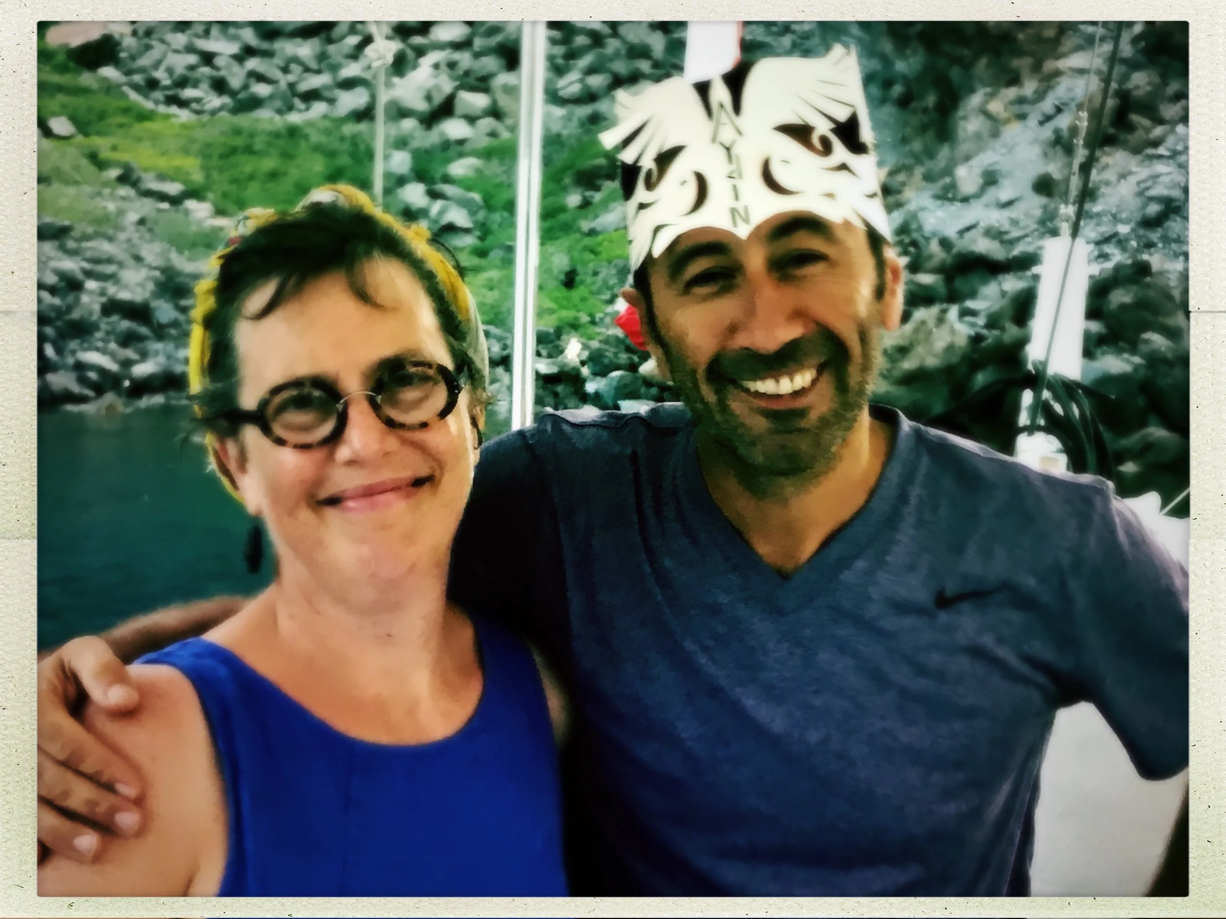 Julie is a pro at turning a little square scarf into a functional headband/sweatband. She wears her scarf rolled tight on her hair (with friend at right wearing a cut paper art crown by Julie).