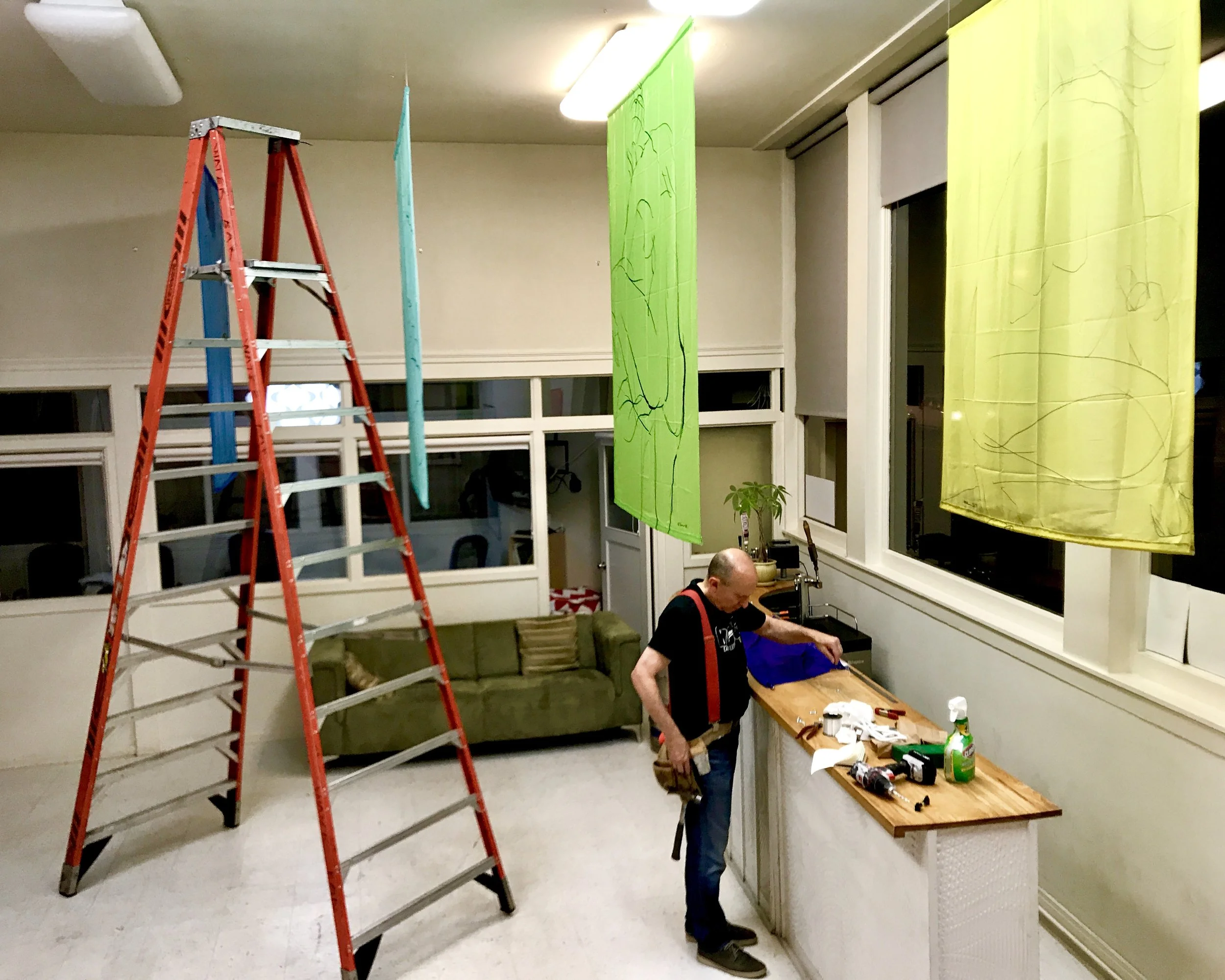 Jack hanging the Banderas Series in a Pythagorean Triangle