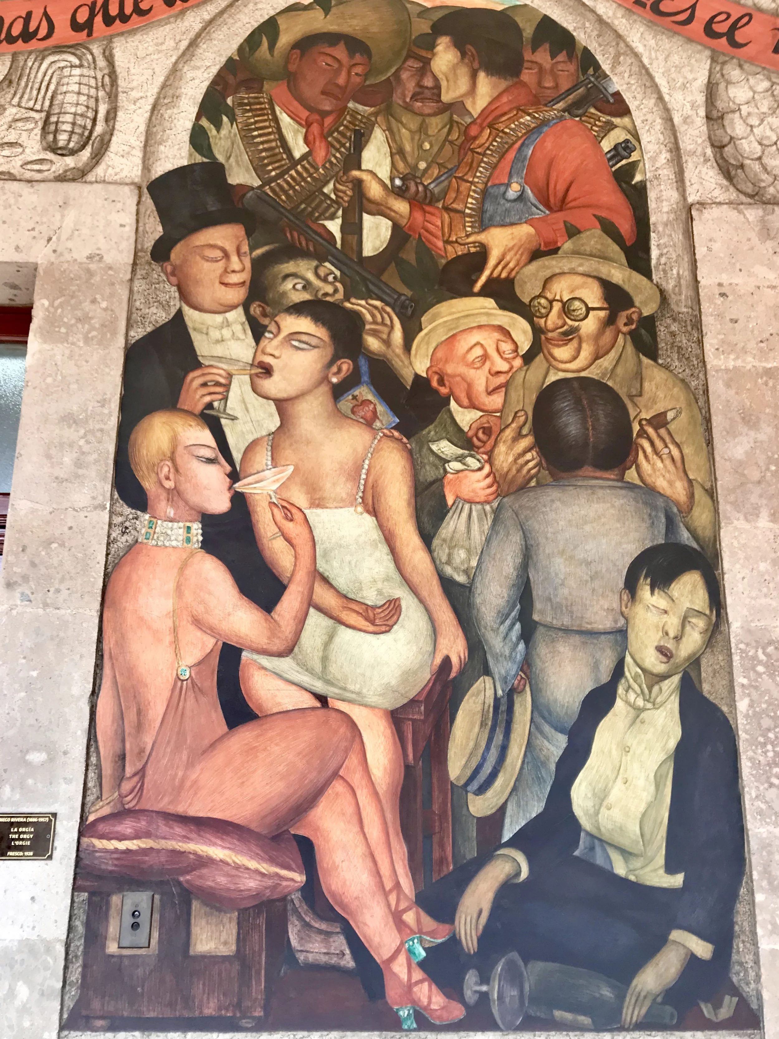 It’s an orgy. About gluttony, I think. Note the soldiers always in the back.