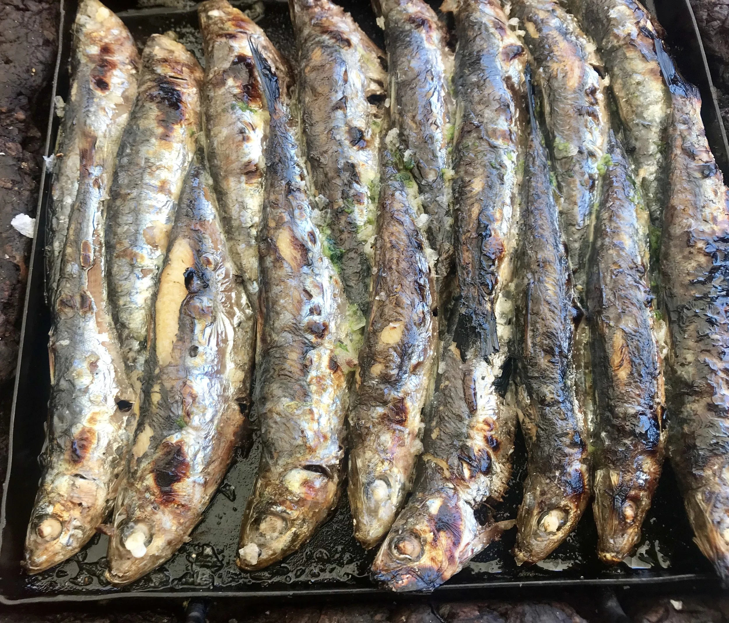 Lunch at the beach starts with these perfectly grilled sardines - so fresh and delicate.
