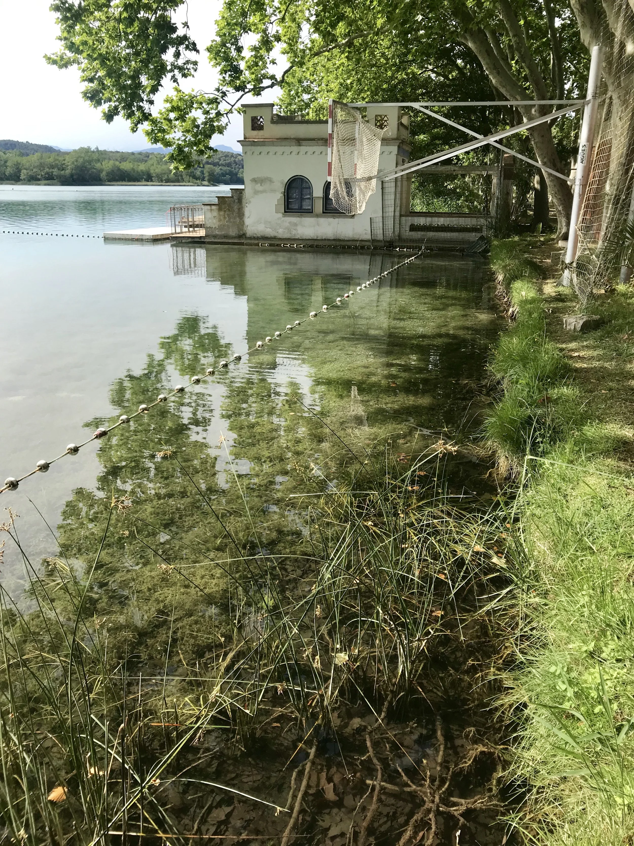 Tiny lake houses dot the shore.