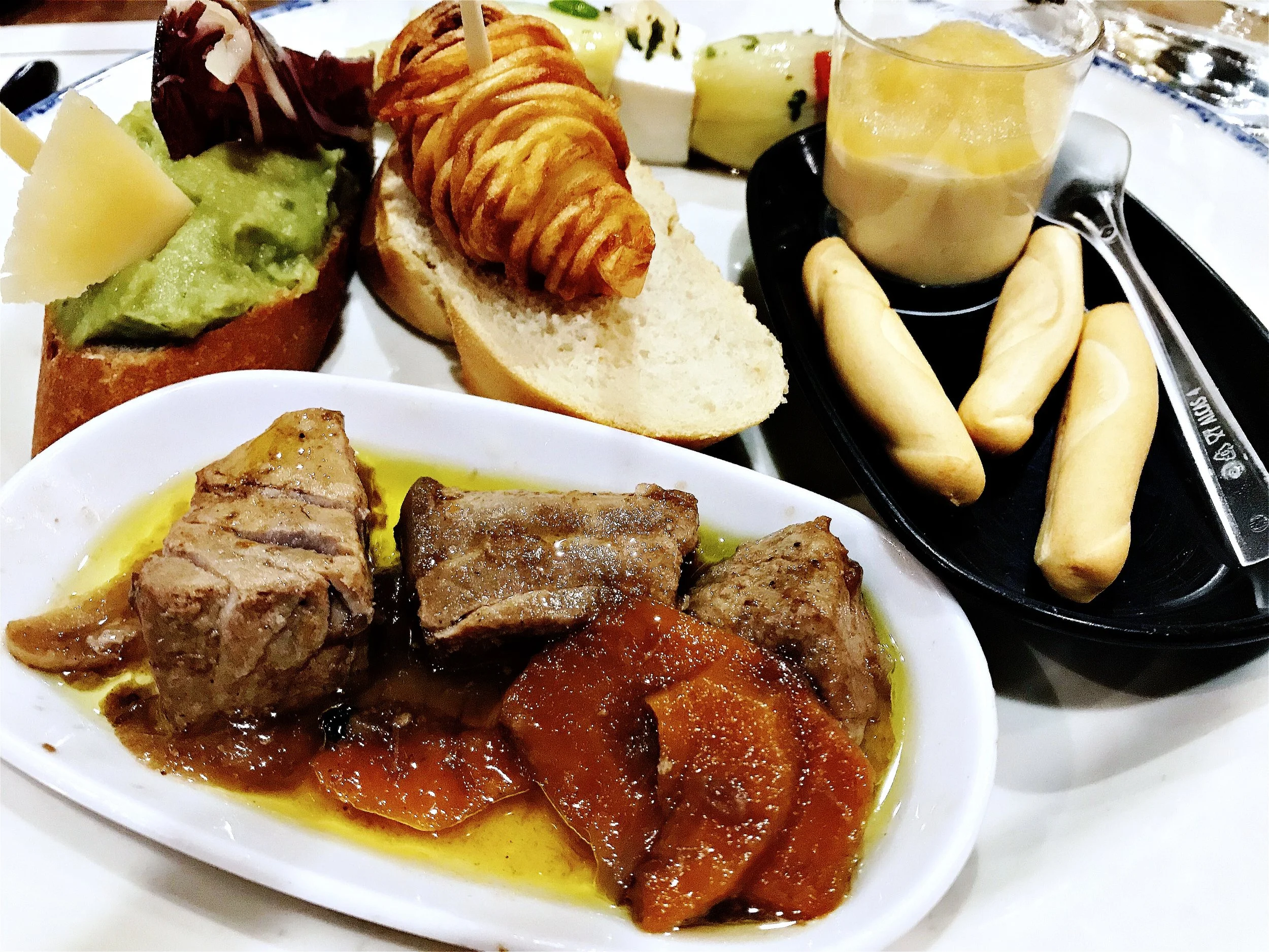 Tuna tapa is featured in front - I keep going back for this dish.