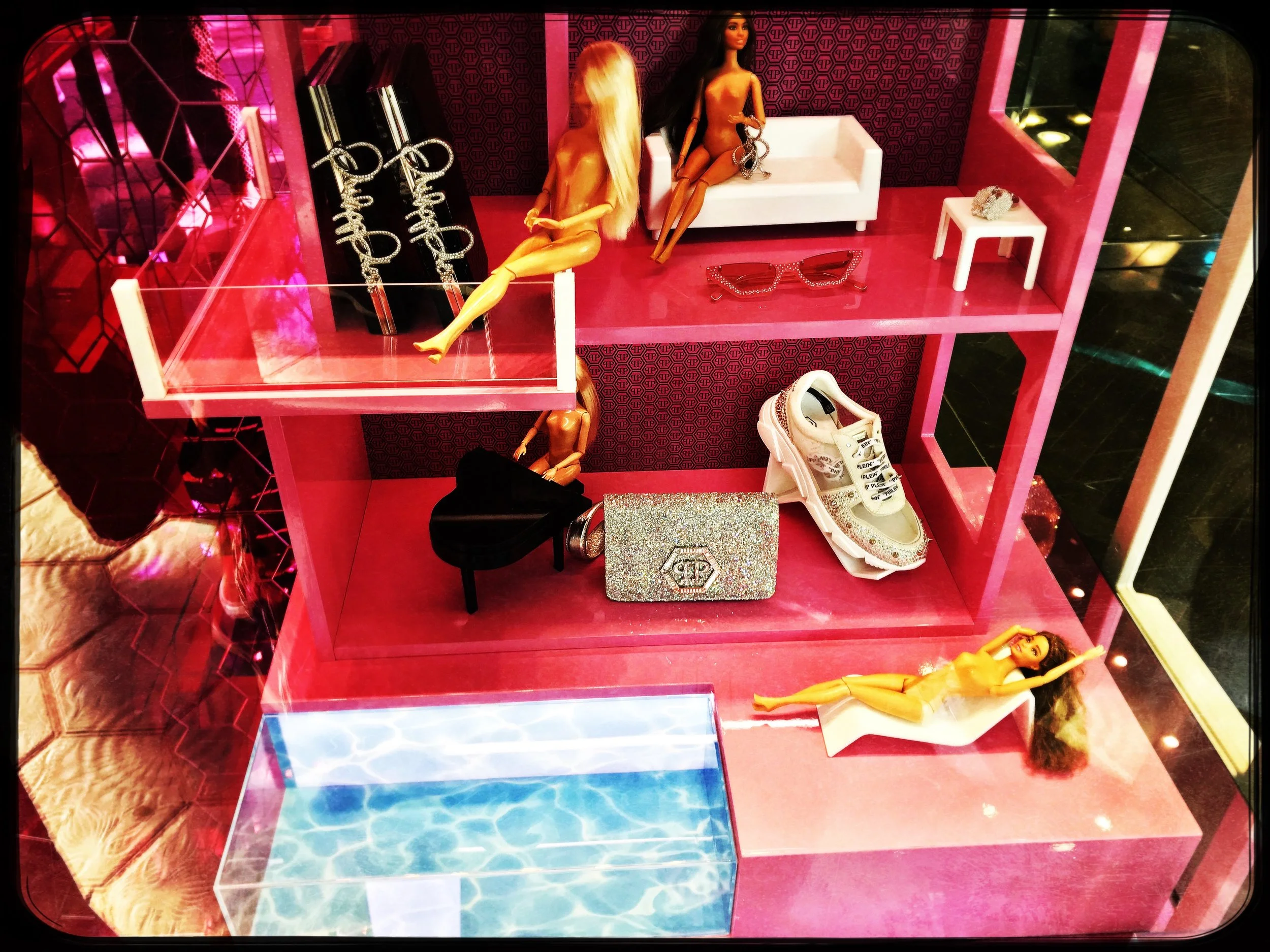 Barbie’s friends - a bunch of new, naked Barbies dominate a shoestore display in Barcelona.