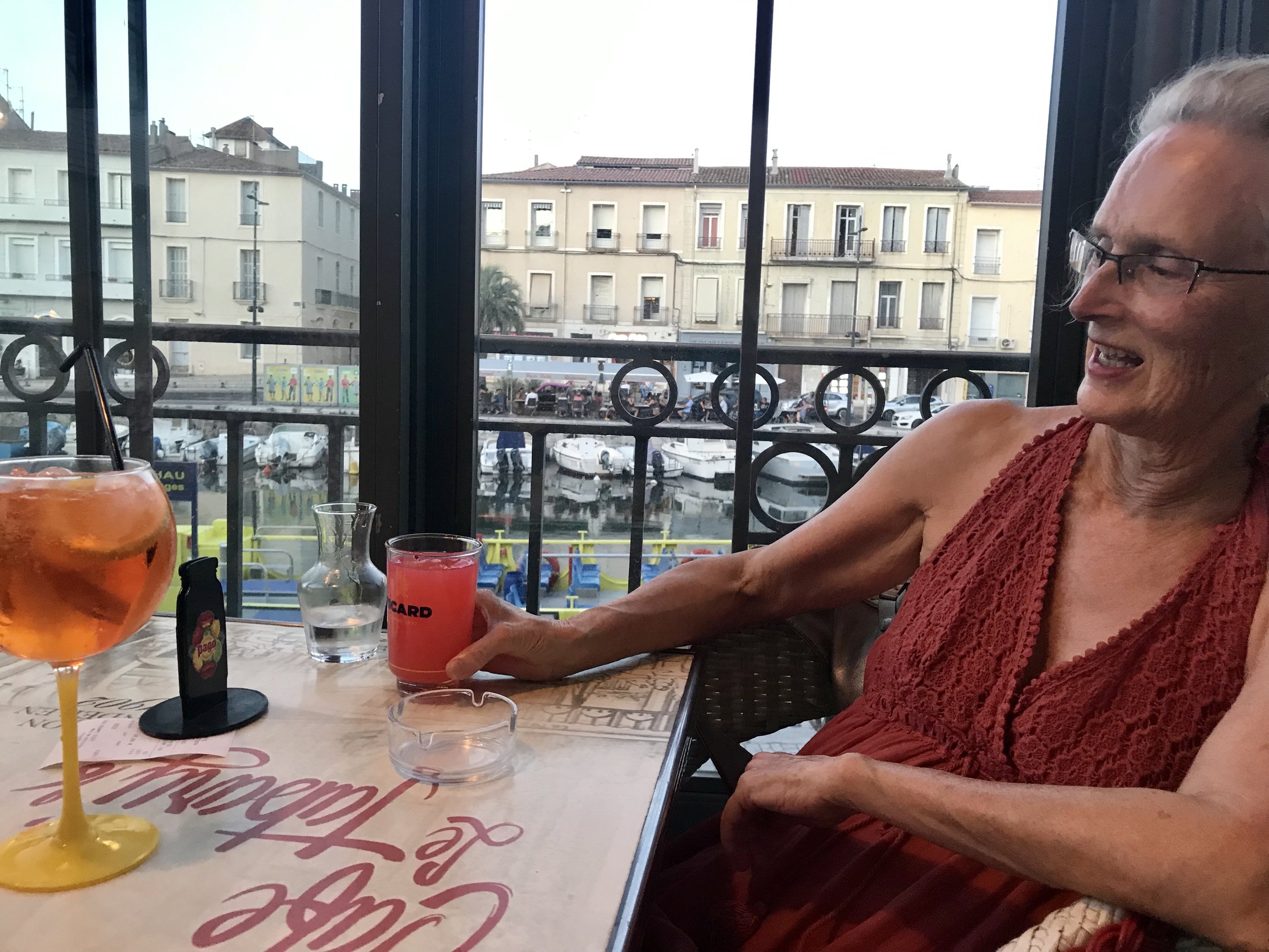 Diana sipping by the canal in Sete, France.