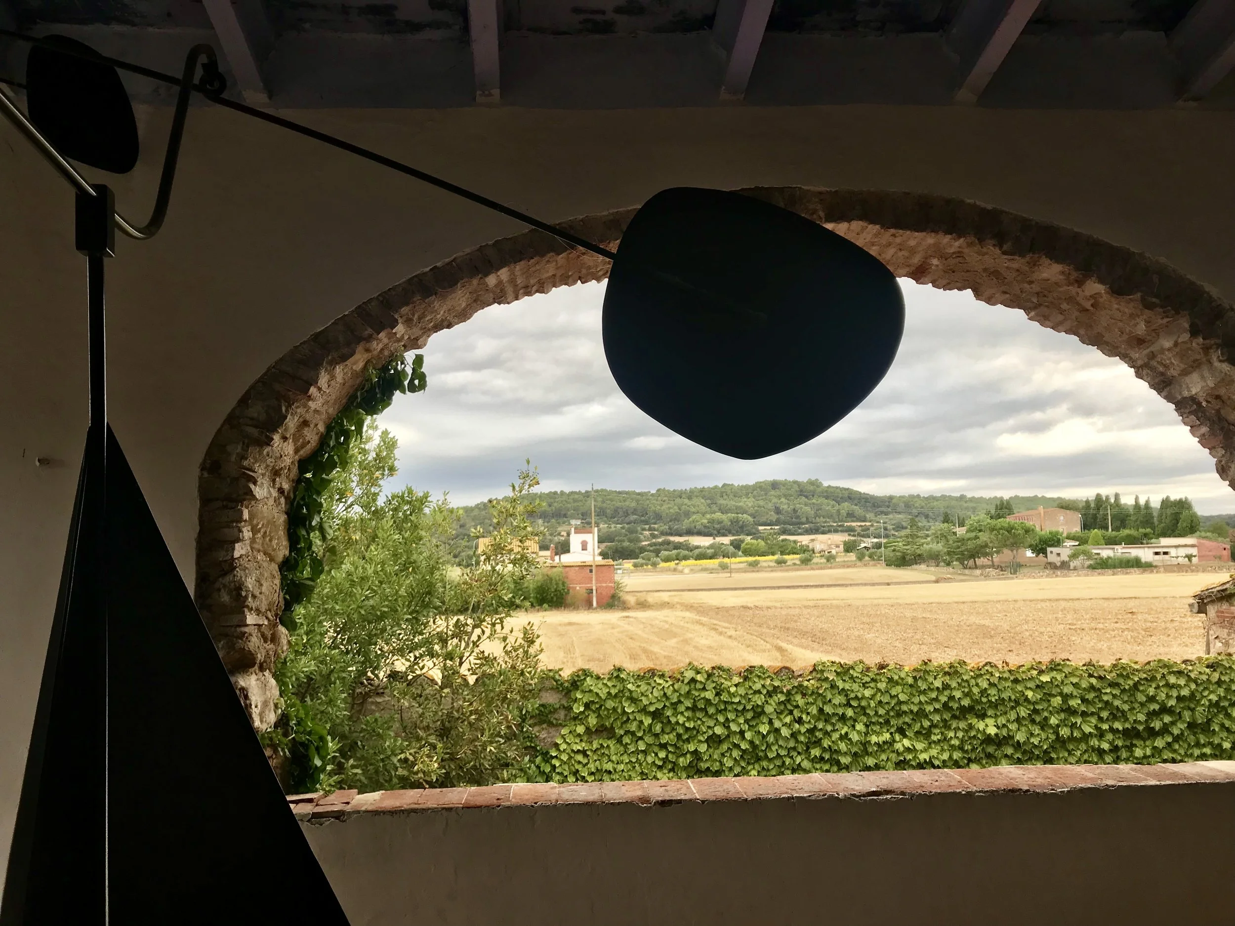 Catalan village arch opens out to farmland