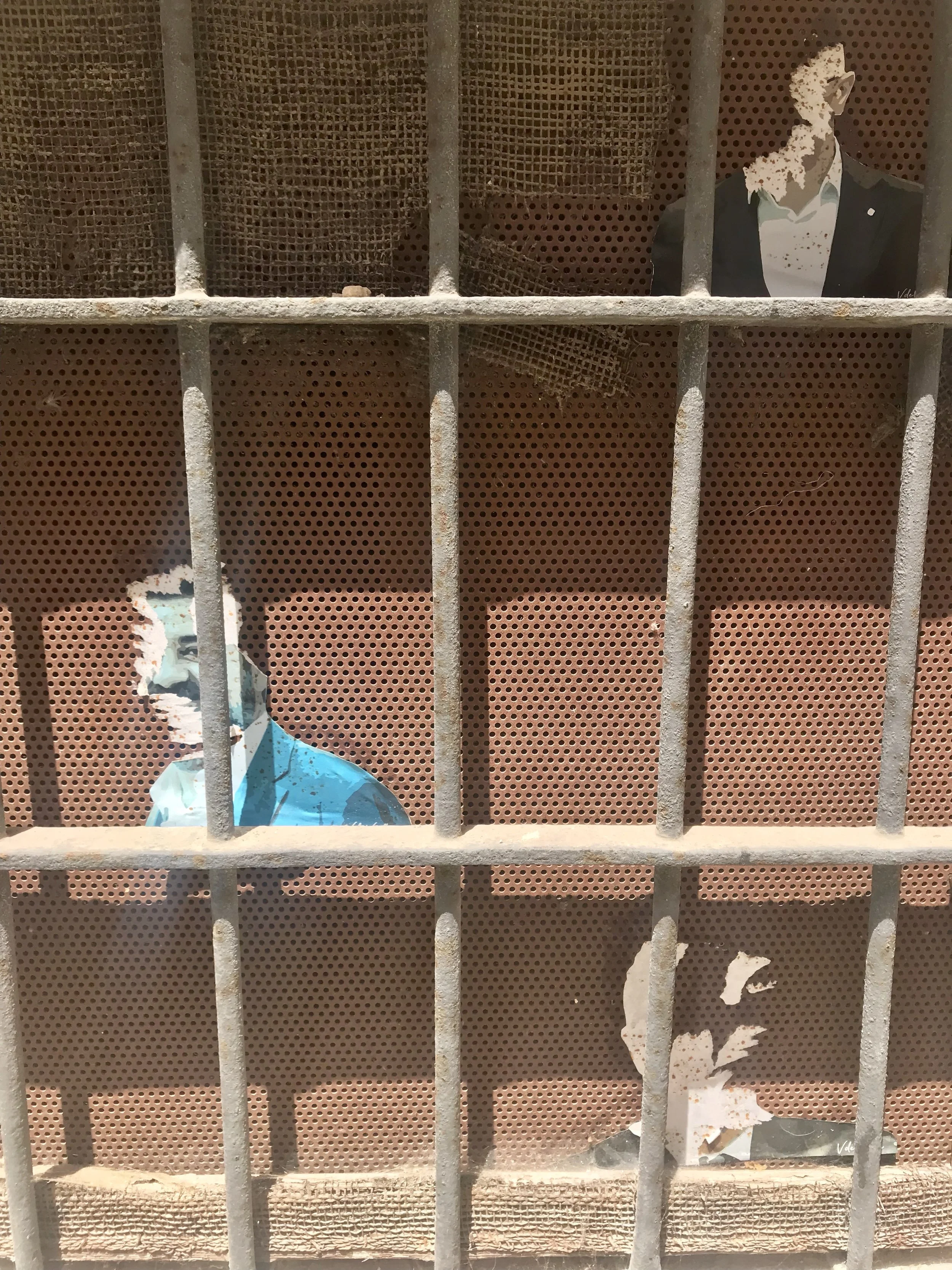 Village window with metal screen and cut outs