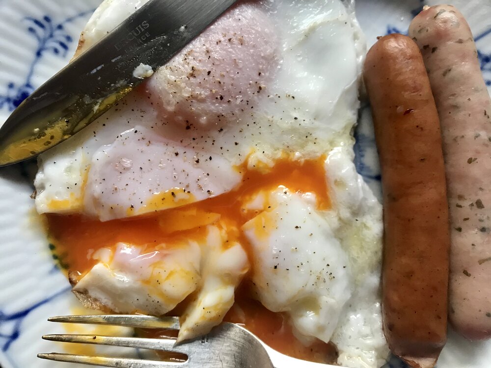 American breakfast with deep orange egg yolks