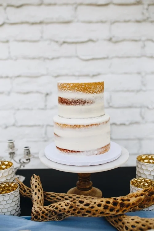Naked romantic desert wedding cake at Tercero Weddings by Aldea in Glendale, Arizona
