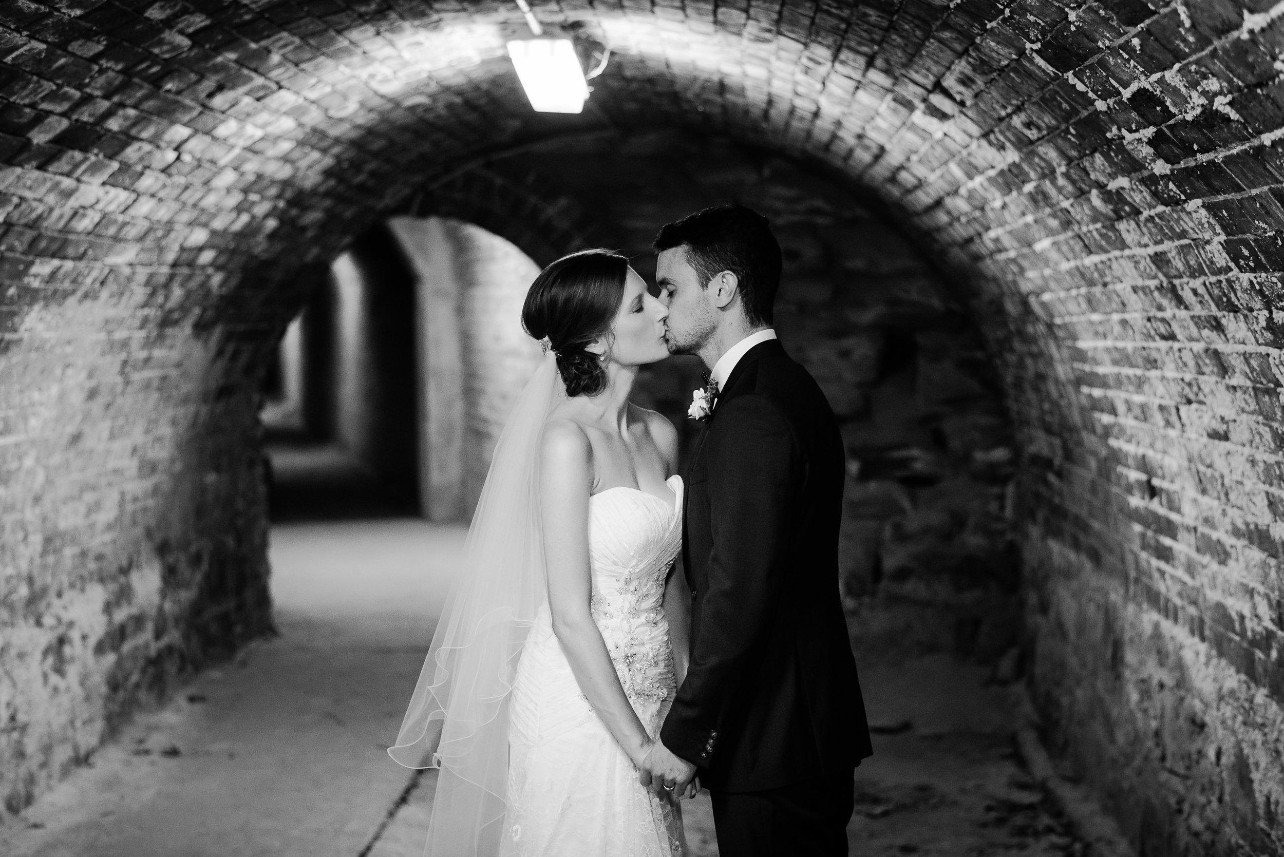 Bride and Groom kissing in the secret tunnels under Fortuna Villa Bendigo