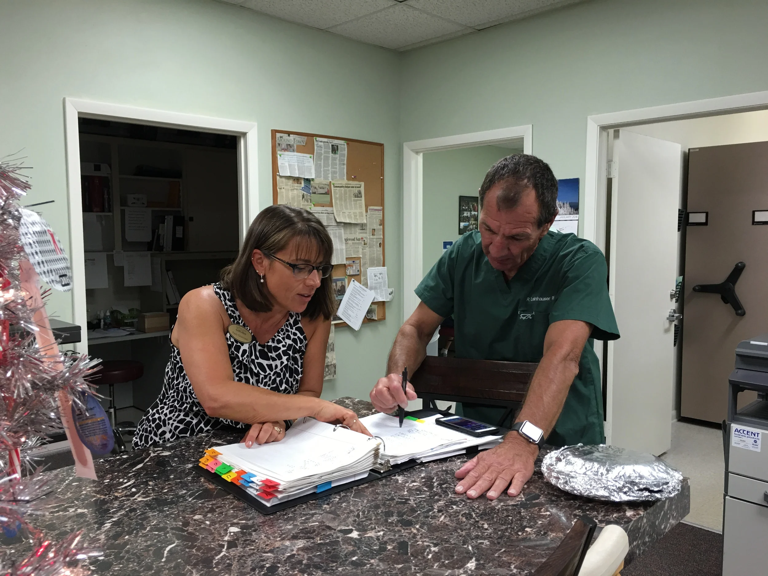  Our Board member Paula Greenland works with volunteer RN Bob Linehauser. 